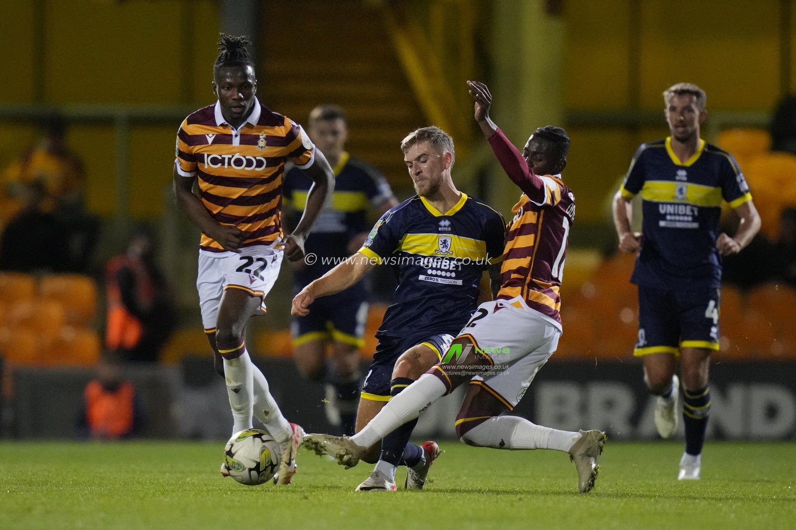 Clarke Oduor #12 of Bradford City competes for the ball with Riley McGree #8 of Middlesbrough during the Carabao Cup match Bradford City vs Middlesbrough at University of Bradford Stadium, Bradford, United Kingdom, 26th September 2023

(Photo by Steve Flynn/News Images)