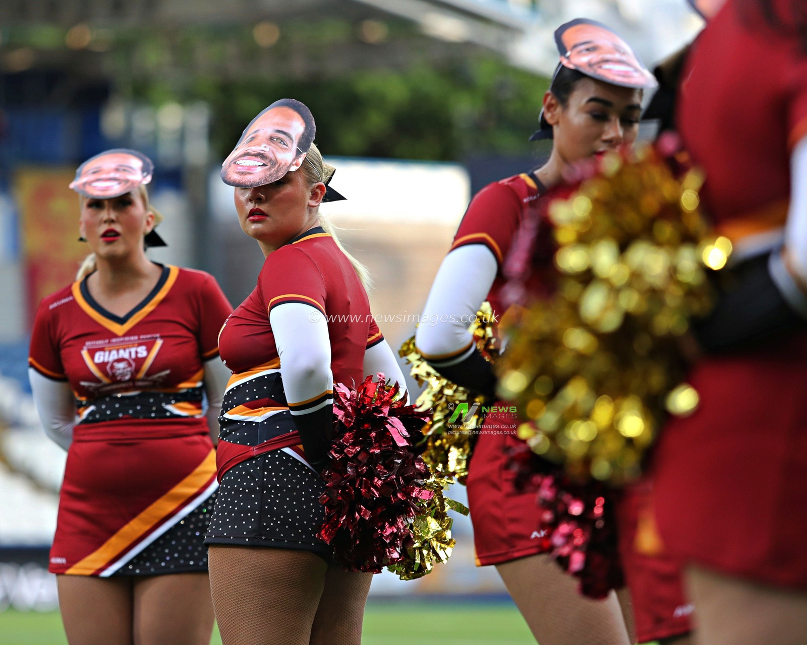 Huddersfield cheerleaders with Leroy Cudjoe of Huddersfield Giants masks before the Betfred Super League round 19 match Huddersfield Giants vs Wakefield Trinity at the Accu Stadium, Huddersfield, United Kingdom, 18th July 2025

(Photo by Sam Eaden/News Images)