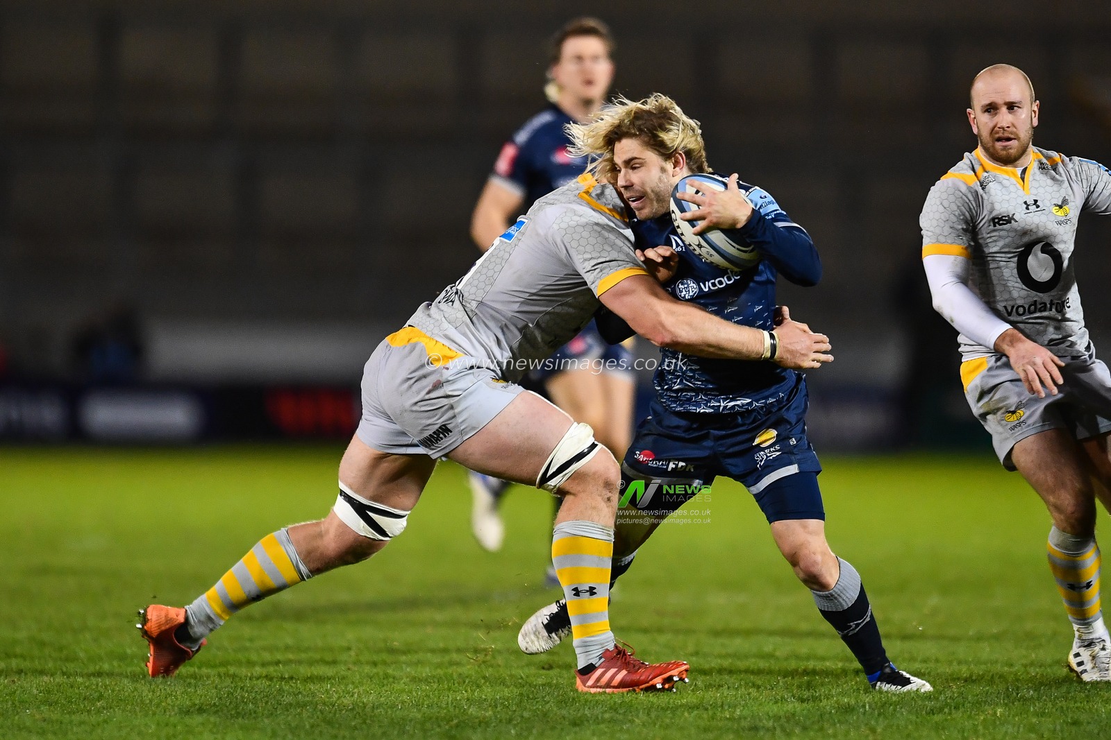 Faf de Klerk of Sale Sharks is tackled by Ben Morris of Wasps