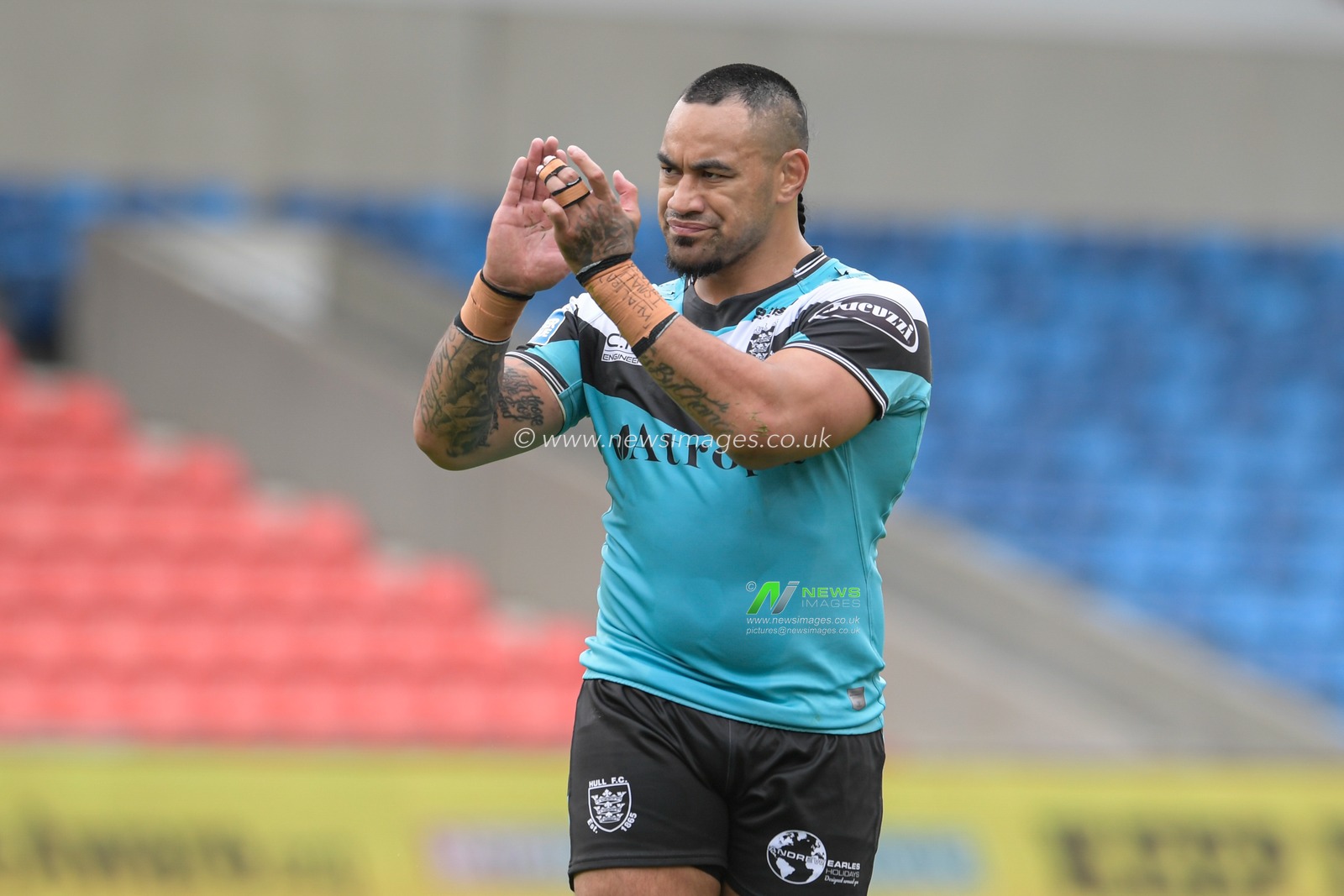 Mahe Fonua (5) of Hull FC applauds the travelling supporters at the end of the game