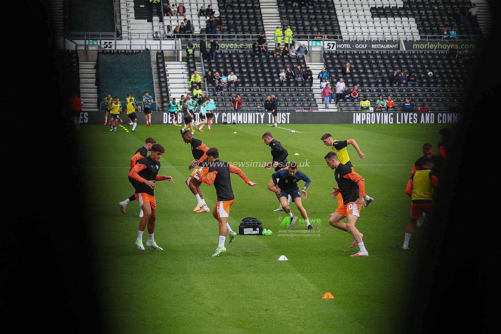 Blackpool players during the pre-game warm up ahead of the Carabao Cup match Derby County vs Blackpool at Pride Park Stadium, Derby, United Kingdom, 8th August 2023

(Photo by Gareth Evans/News Images)