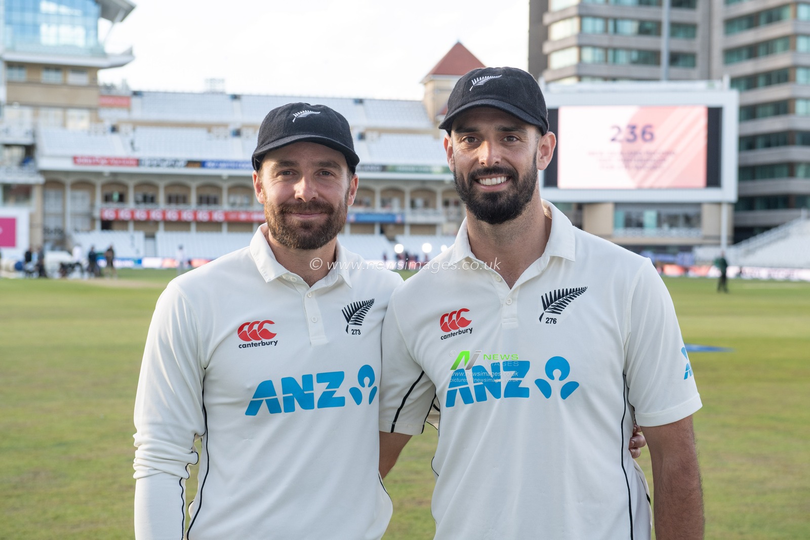 Tom Blundell of New Zealand (L) and Daryl Mitchell of New Zealand (R) break the New Zealand record test partnership for fifth wicket during day 2 of the 2nd Test between the New Zealand Blackcaps and England at Trent Bridge Cricket Ground, Nottingham, England on Saturday 11 June 2022.