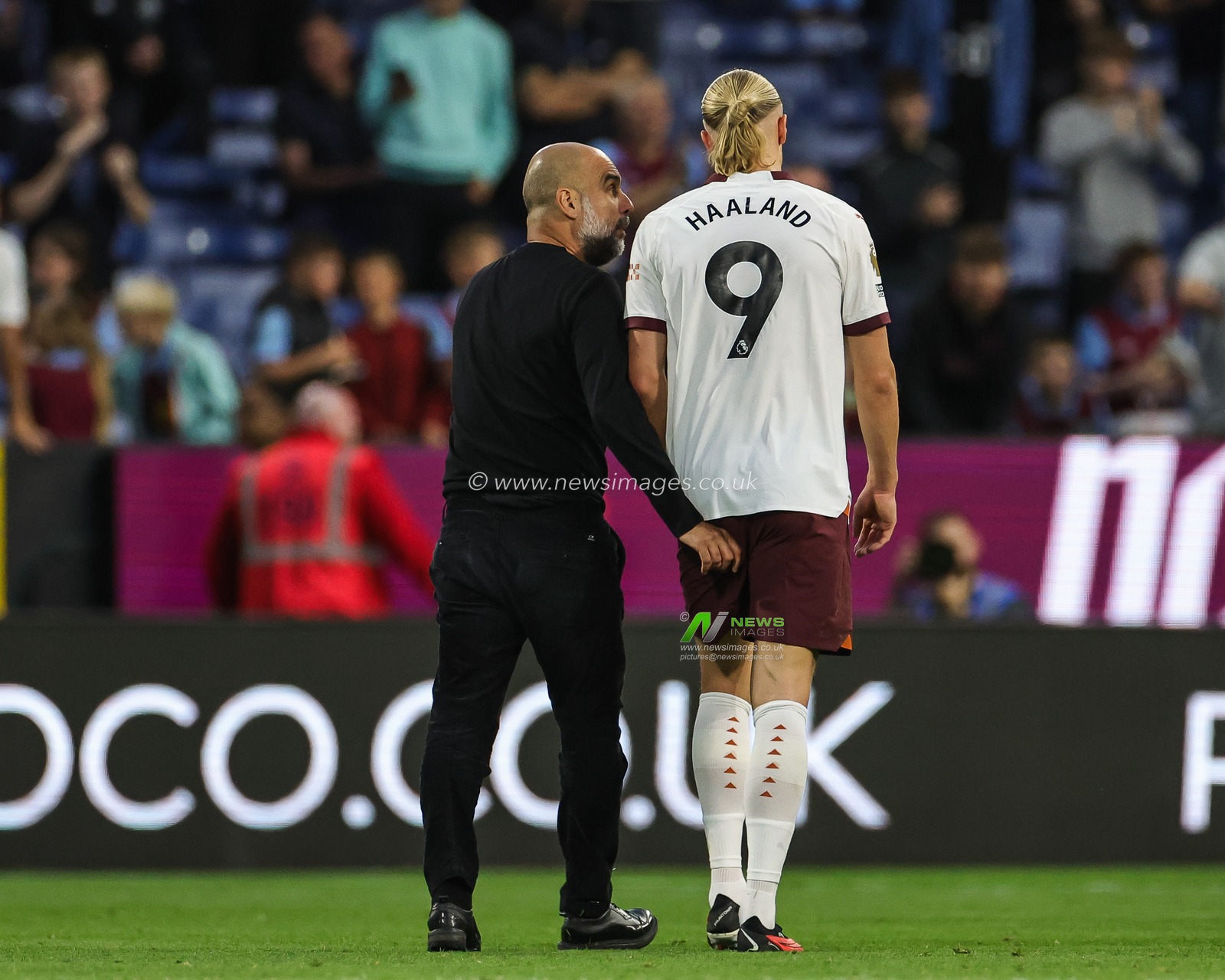 Pep Guardiola head coach of Manchester City speaks to Erling Haaland of Manchester City as the leave the pitch at half time during the Premier League match Burnley vs Manchester City at Turf Moor, Burnley, United Kingdom, 11th August 2023

(Photo by Mark Cosgrove/News Images)