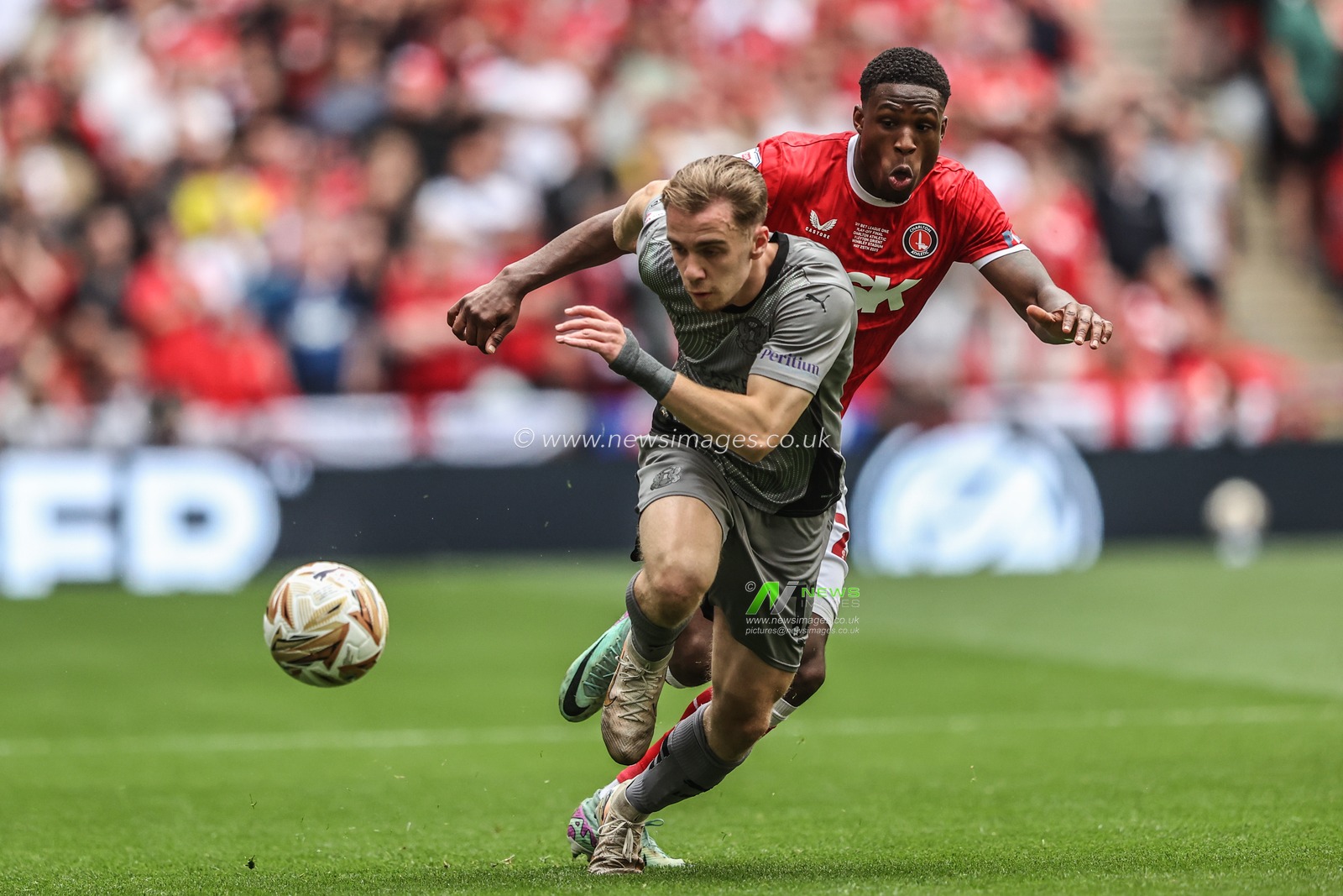Thierry Small of Charlton Athletic and Jack Currie of Leyton Orient battle for the ball during the Sky Bet League 1 Playoff Final match Charlton Athletic vs Leyton Orient at Wembley Stadium, London, United Kingdom, 25th May 2025

(Photo by Alfie Cosgrove/News Images)