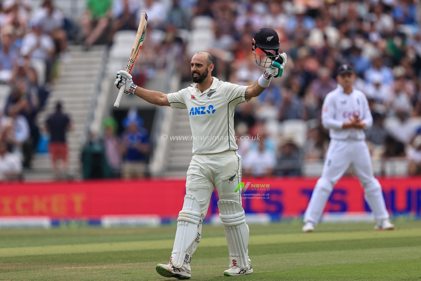 Daryl Mitchell of New Zealand celebrates a century (100 runs)