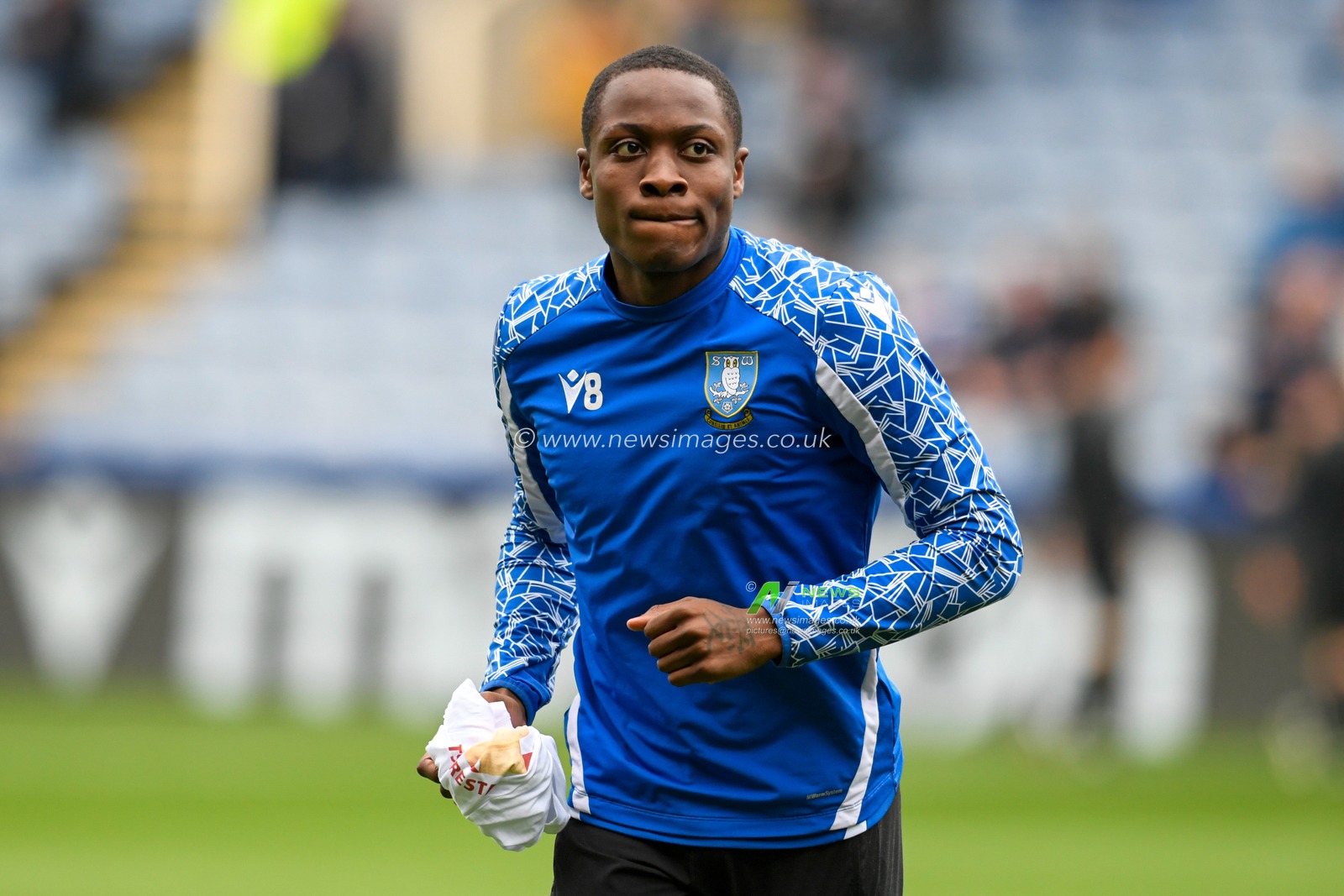 Dennis Adeniran #8 of Sheffield Wednesday warming up before the game