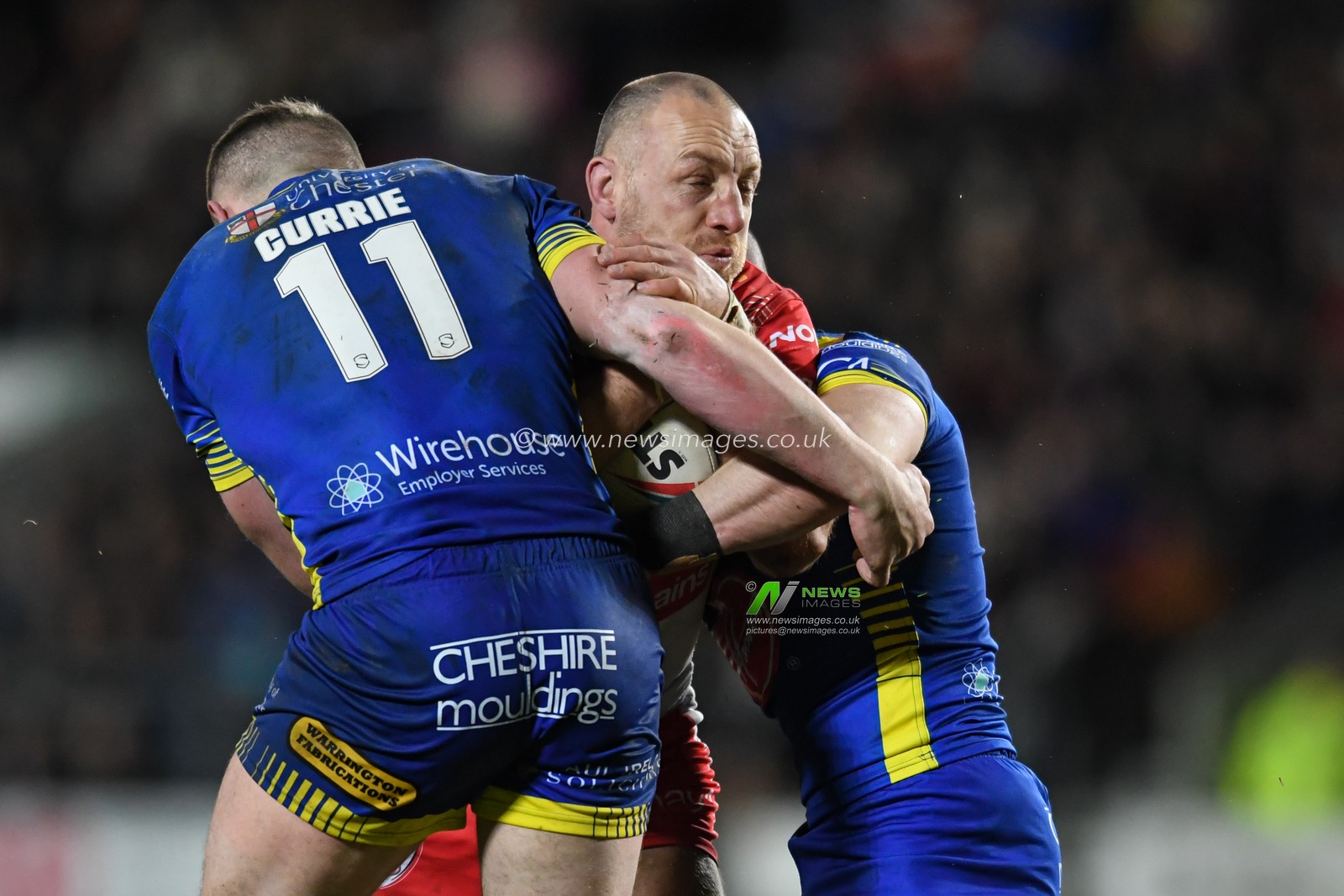 James Roby #9 of St Helens look to drive the ball forward