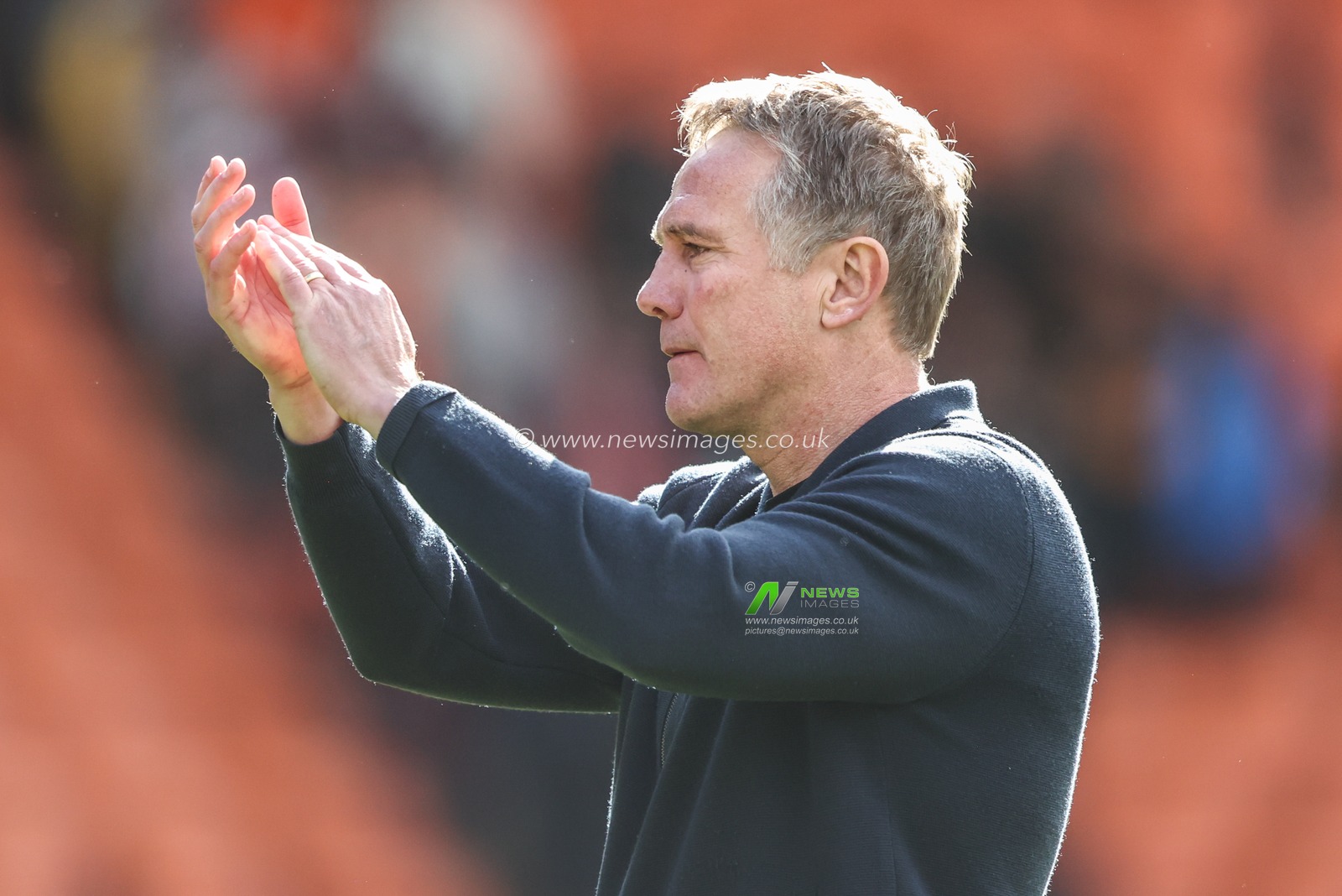 Phil Parkinson manager of Wrexham applauds the fans after the game during the Sky Bet League 1 match Blackpool vs Wrexham at Bloomfield Road, Blackpool, United Kingdom, 21st April 2025

(Photo by Alfie Cosgrove/News Images)