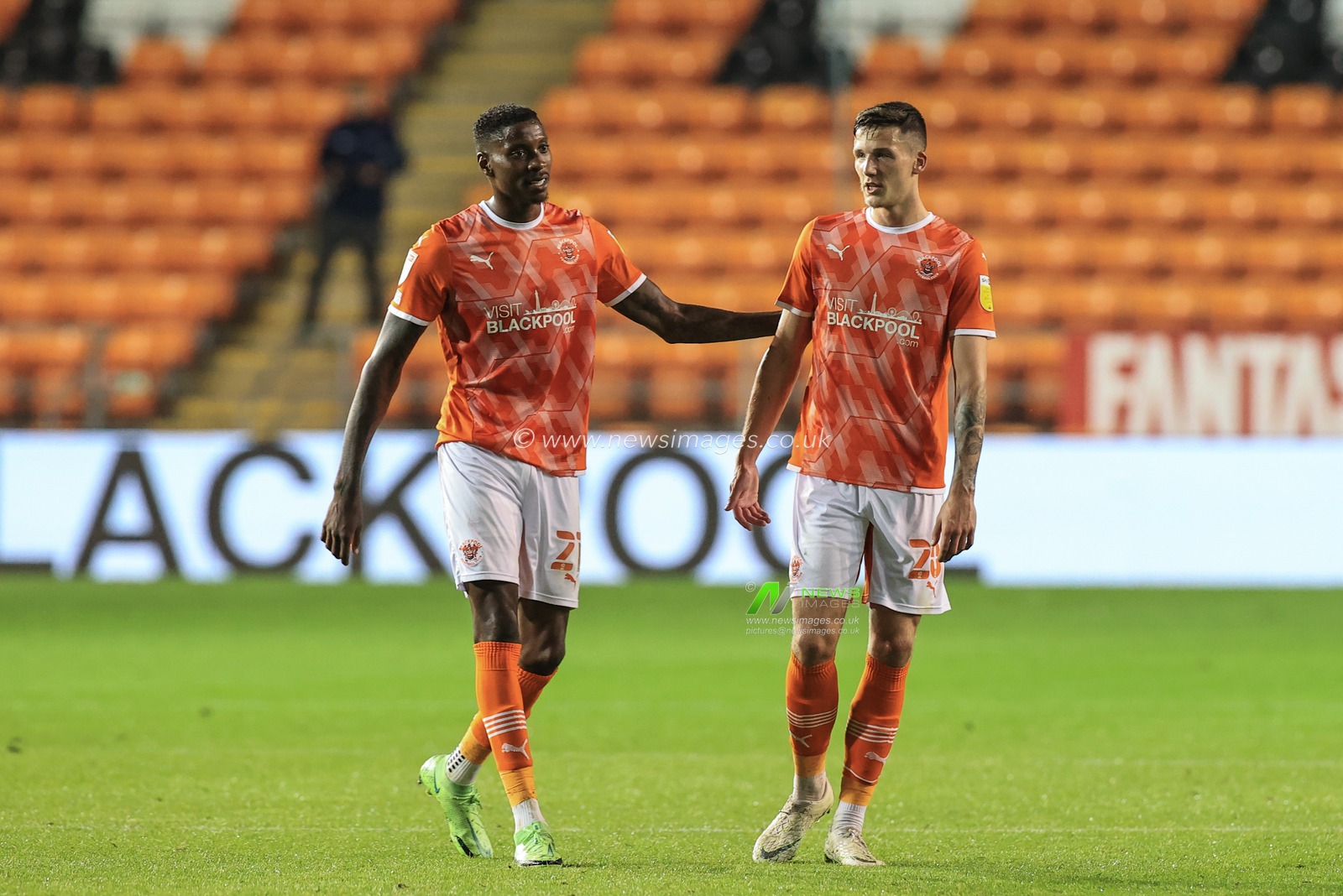 Marvin Ekpiteta #21 of Blackpool and Olly Casey #20 of Blackpool celebrate Blackpoolâ€™s 3-0 win