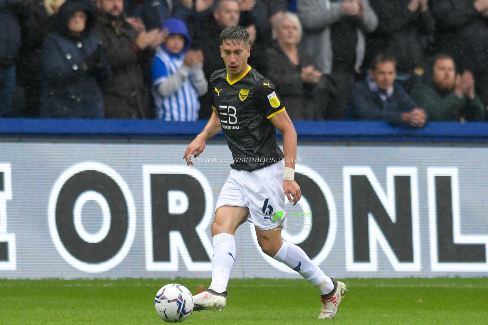 Alex Gorrin #6 of Oxford United with the ball