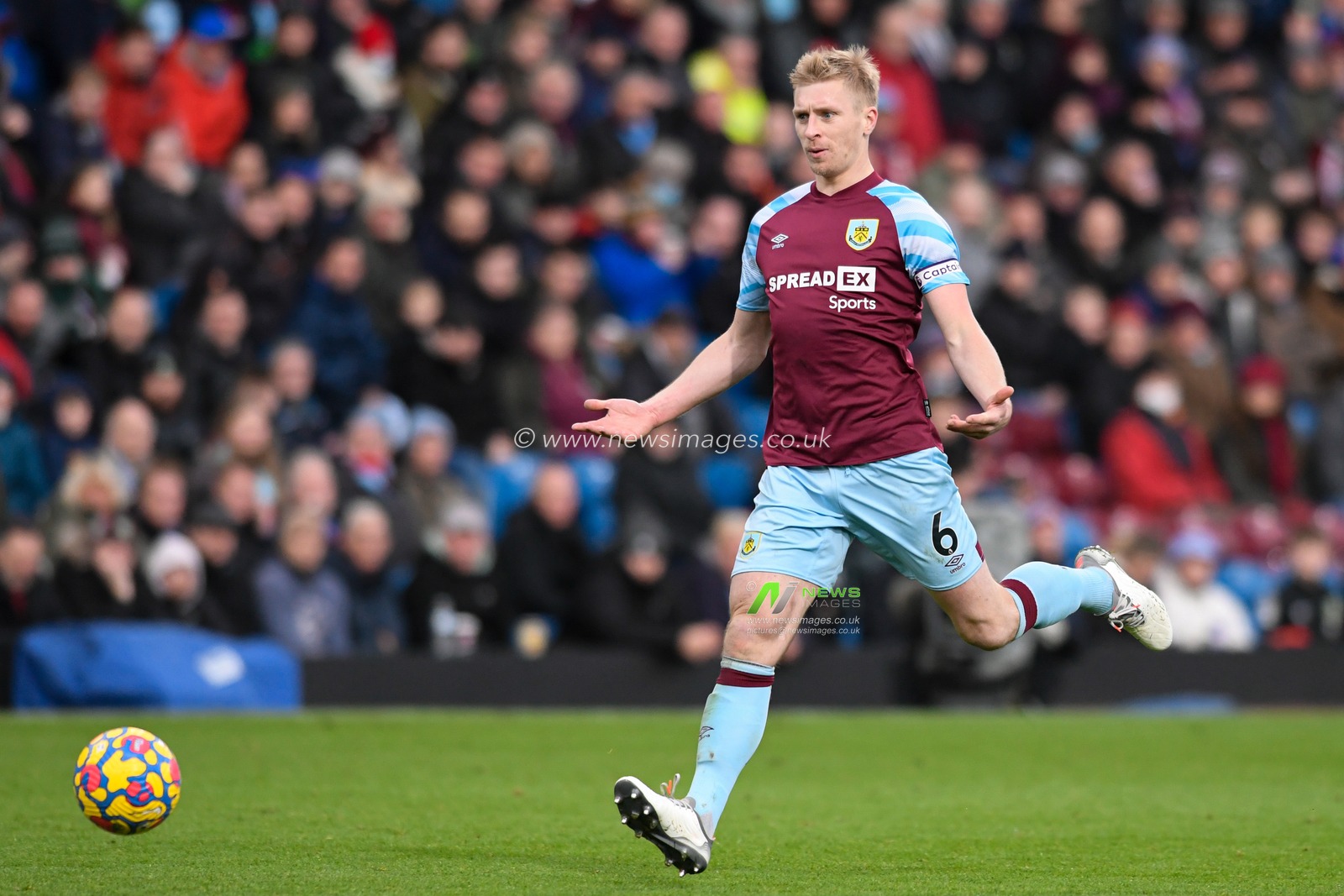 Ben Mee #6 of Burnley appeals to his goalkeeper to collect the ball