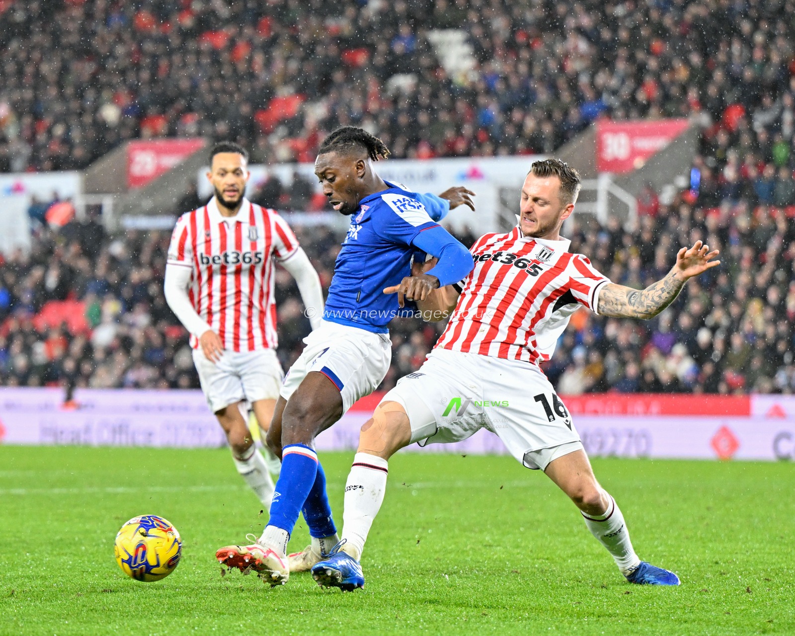 Freddie Ladapo of Ipswich Town and Ben Wilmot of Stoke City battle for the ball, during the Sky Bet Championship match Stoke City vs Ipswich Town at Bet365 Stadium, Stoke-on-Trent, United Kingdom, 1st January 2024

(Photo by Cody Froggatt/News Images)