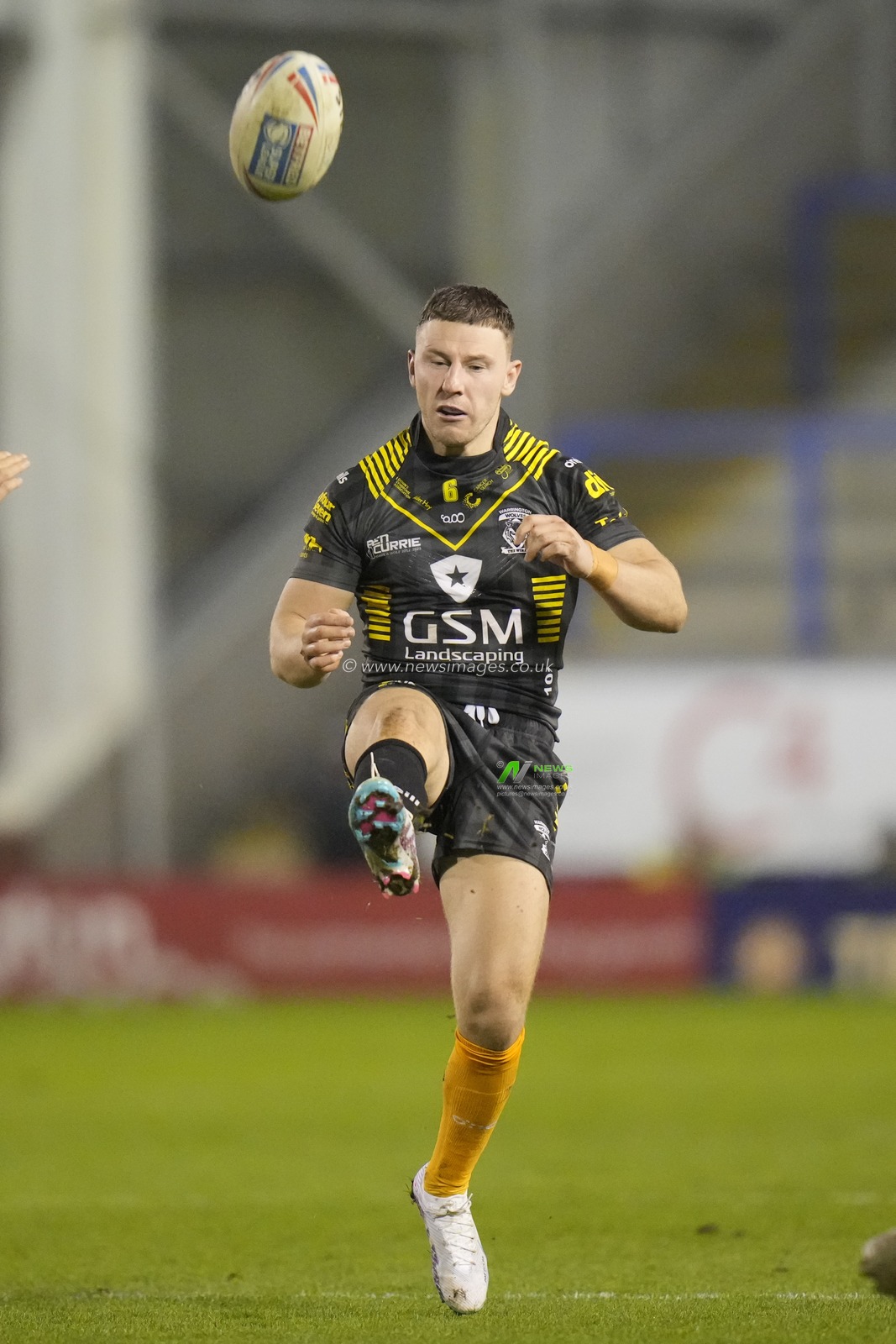 George Williams #6 of Warrington Wolves puts up a kick during the Rugby League Ben Currie Testimonial match Warrington Wolves vs Leigh Leopards at Halliwell Jones Stadium, Warrington, United Kingdom, 4th February 2023

(Photo by Steve Flynn/News Images)