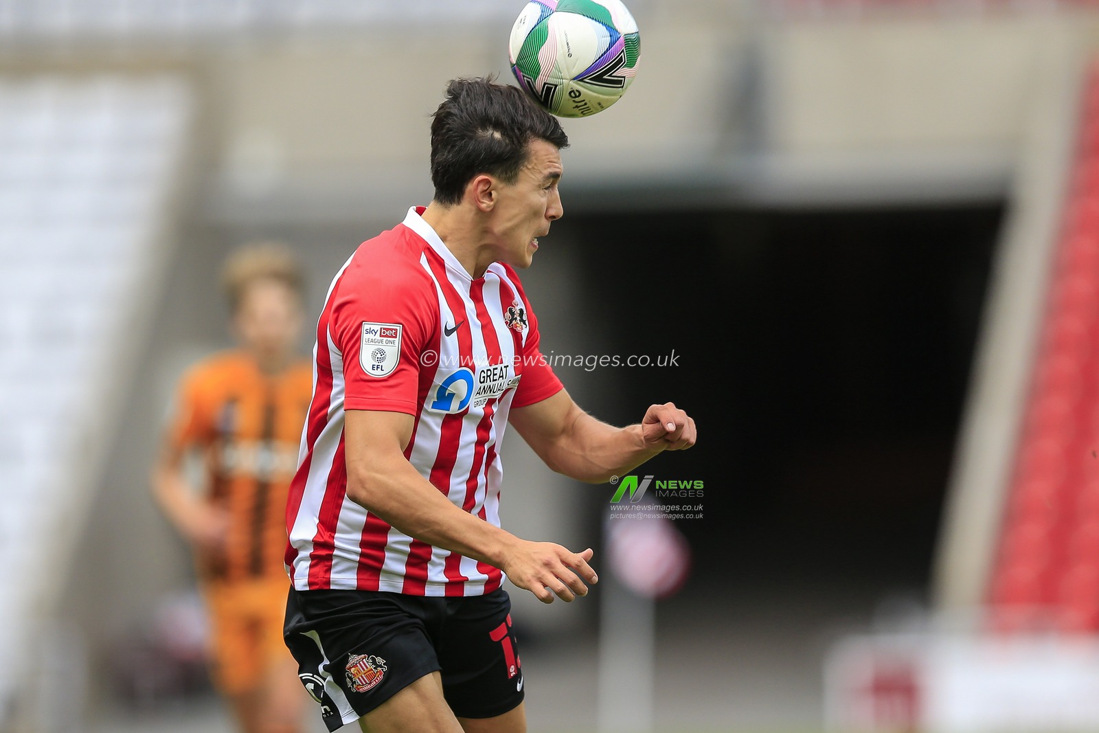 Luke O'Nien (13) of Sunderland heads the ball