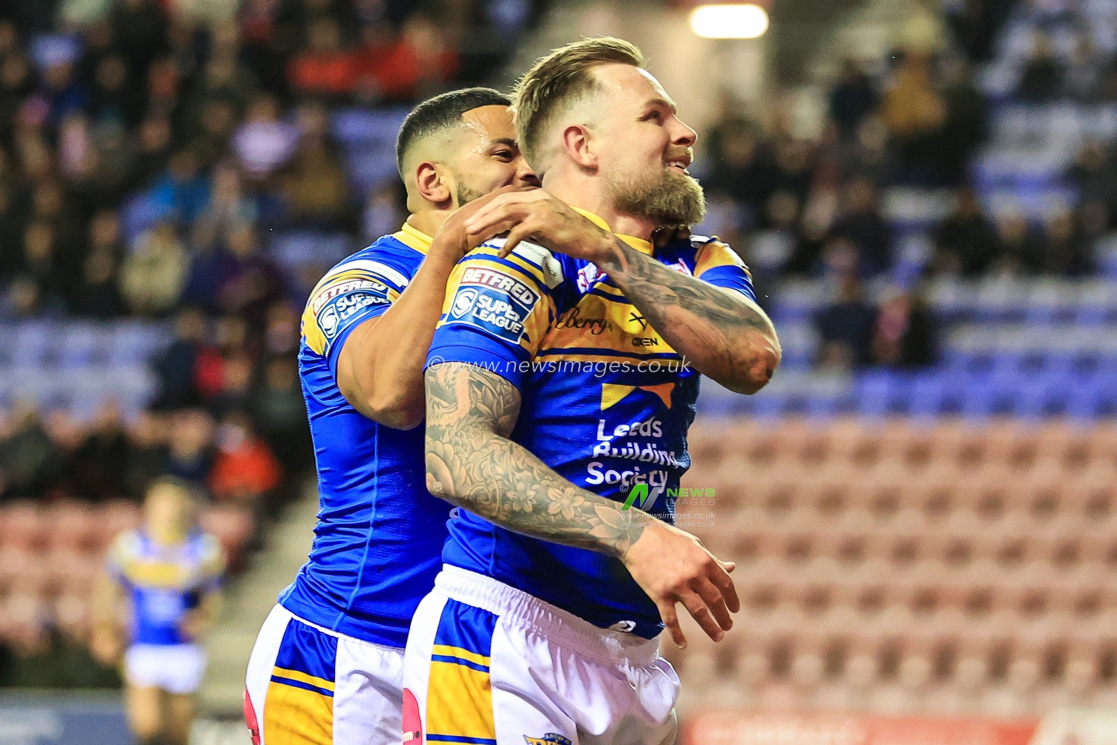 Blake Austin #6 of Leeds Rhinos celebrates his try