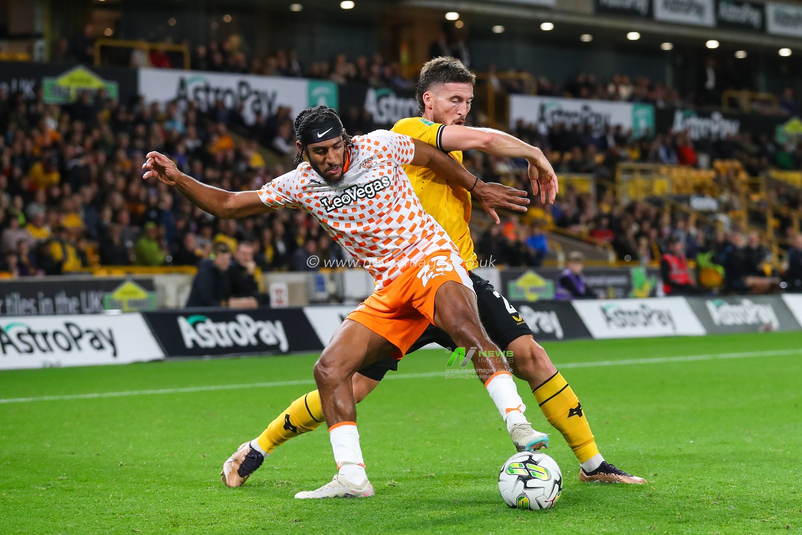 Dominic Thompson #23 of Blackpool holds off Matt Doherty #2 of Wolverhampton Wanderers during the Carabao Cup match Wolverhampton Wanderers vs Blackpool at Molineux, Wolverhampton, United Kingdom, 29th August 2023

(Photo by Gareth Evans/News Images)