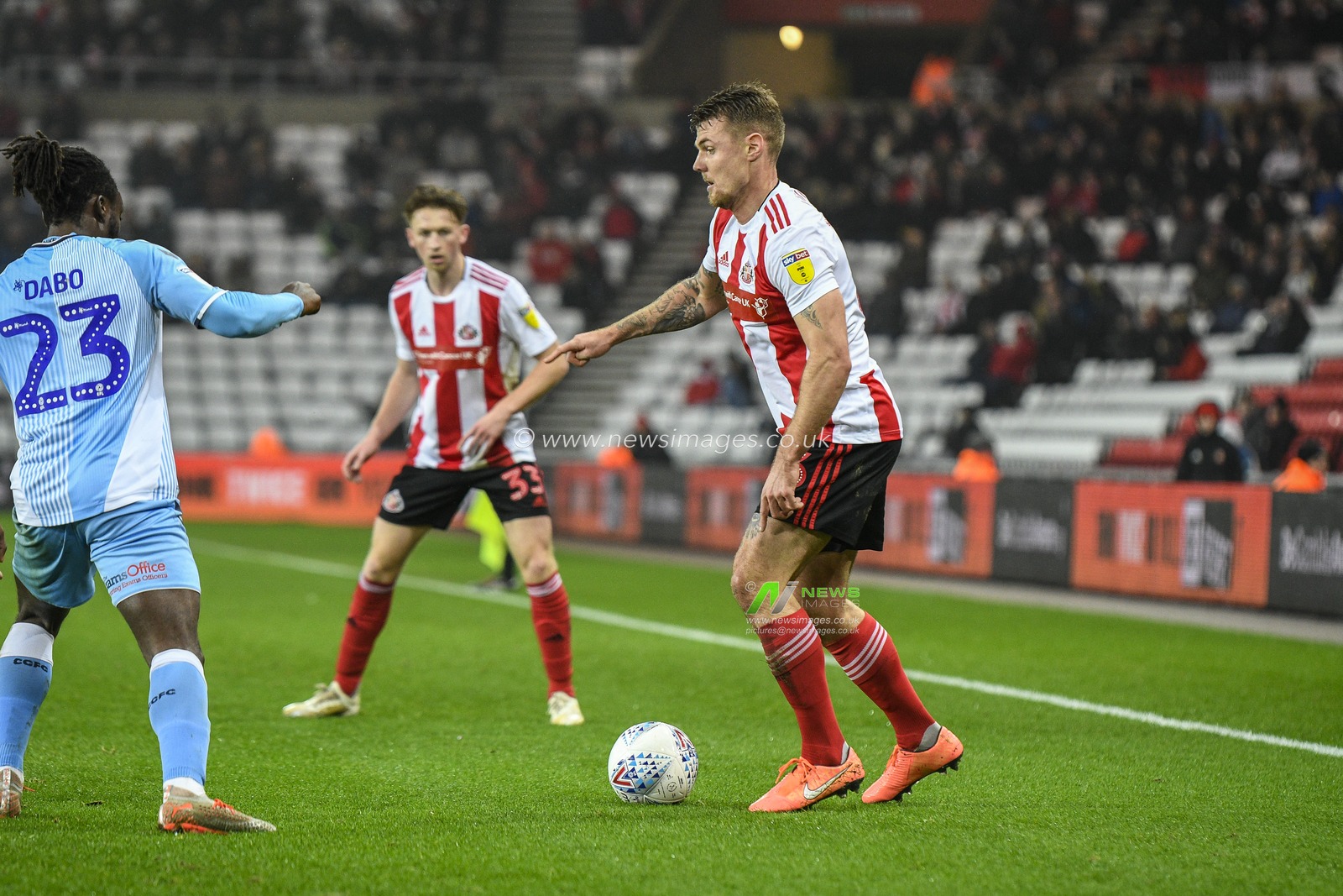 23rd November 2019, Stadium Of Light, Sunderland, England; Sky Bet League 1, Sunderland v Coventry City : Max Power (6) of Sunderland under pressure from Fankaty Dabo (23) of Coventry City

Credit: Iam Burn/News Images