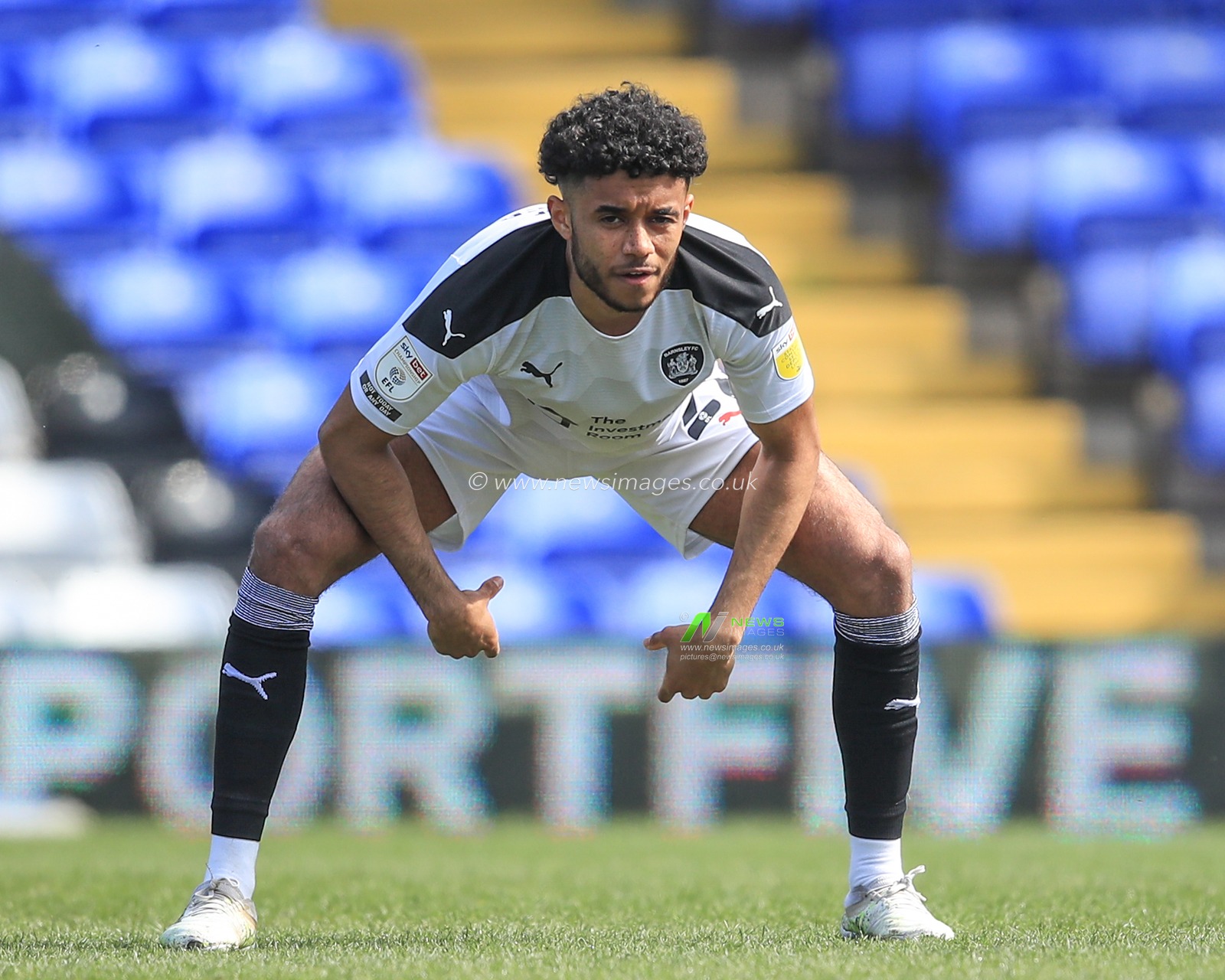 Romal Palmer #21 of Barnsley stretching before kick-off
