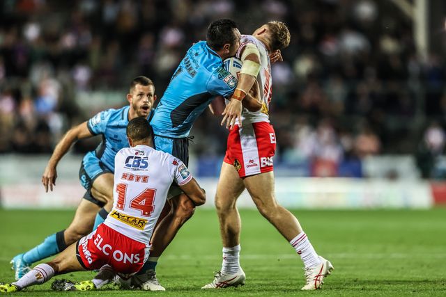Jordan Rapana of Hull FC is tackled by Moses Mbye of St. Helens during the Betfred Super League round 23 match St Helens vs Hull FC at Totally Wicked Stadium, St Helens, United Kingdom, 22nd August 2025

(Photo by Alfie Cosgrove/News Images)