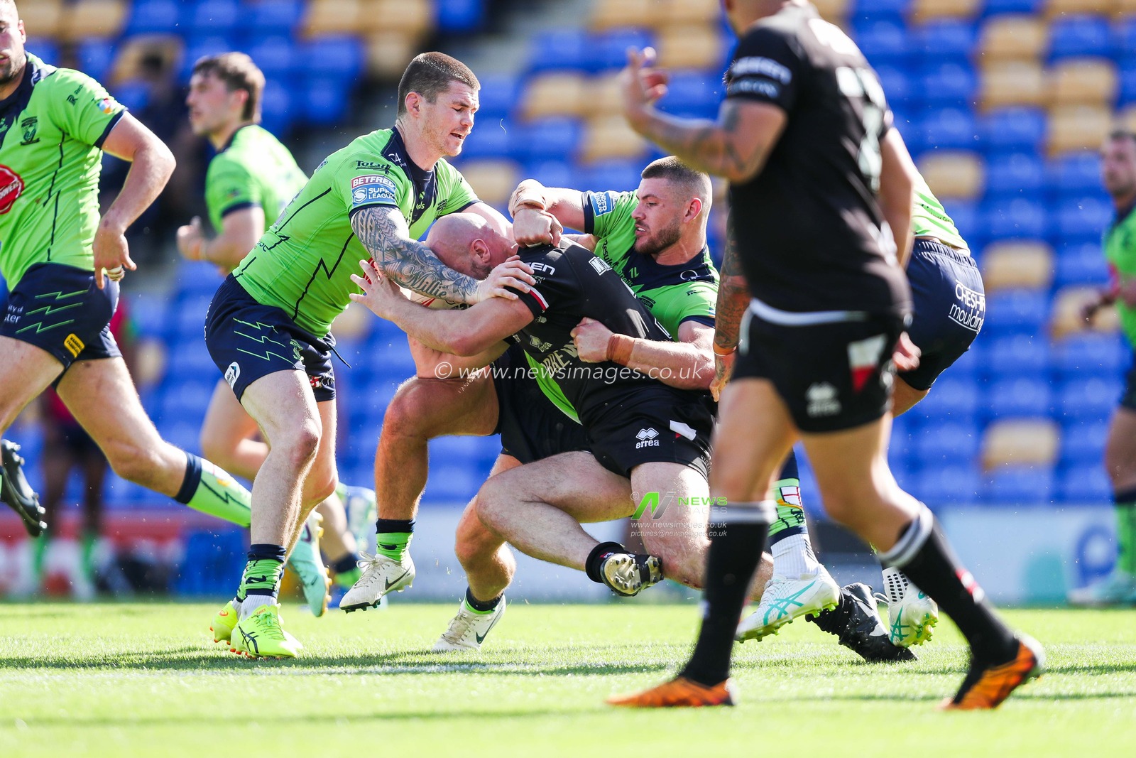 John Bateman and Danny Walker of Warrington Wolves make a tackle during the Betfred Super League Round 21 match London Broncos vs Warrington Wolves at Plough Lane, Wimbledon, United Kingdom, 11th August 2024

(Photo by Izzy Poles/News Images)