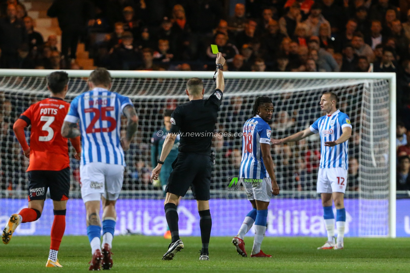 David Kasumu #18 of Huddersfield Town receives a yellow card during the Sky Bet Championship match Luton Town vs Huddersfield Town at Kenilworth Road, Luton, United Kingdom, 4th October 2022

(Photo by Arron Gent/News Images)