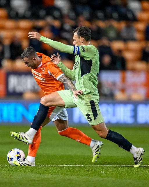 Kal Naismith of Luton Town  tackles Dale Taylor of Blackpool during the Sky Bet League 1 match Blackpool vs Luton Town at Bloomfield Road, Blackpool, United Kingdom, 30th September 2025

(Photo by Adam Gee/News Images)