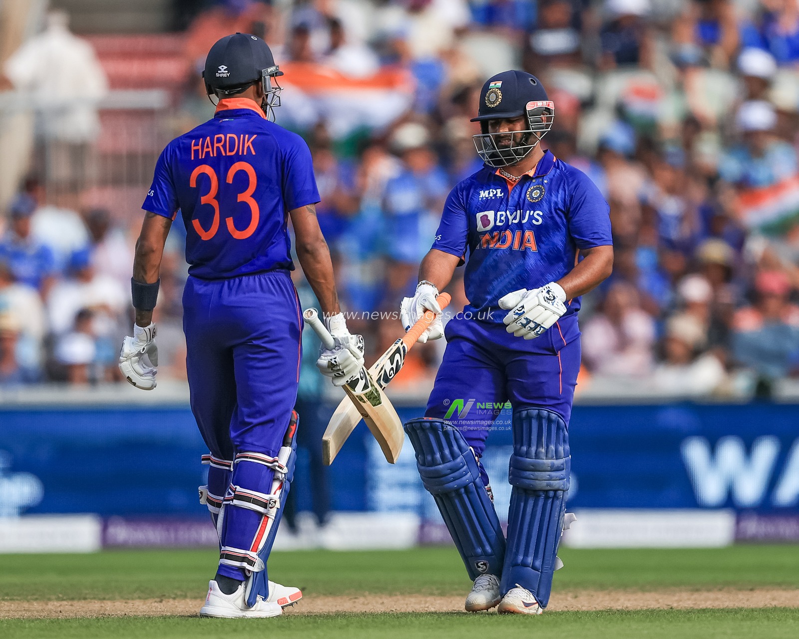 Rishabh Pant of India celebrates a boundary with Hardik Pandya of India
