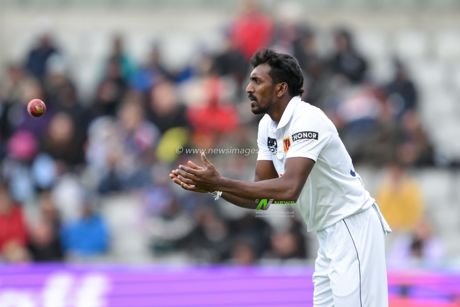 Milan Rathnayake of Sri Lanka receives the ball during the England Men v Sri Lanka 1st Rothesay Test Match Day 2 at Old Trafford, Manchester, United Kingdom, 22nd August 2024

(Photo by Craig Thomas/News Images)