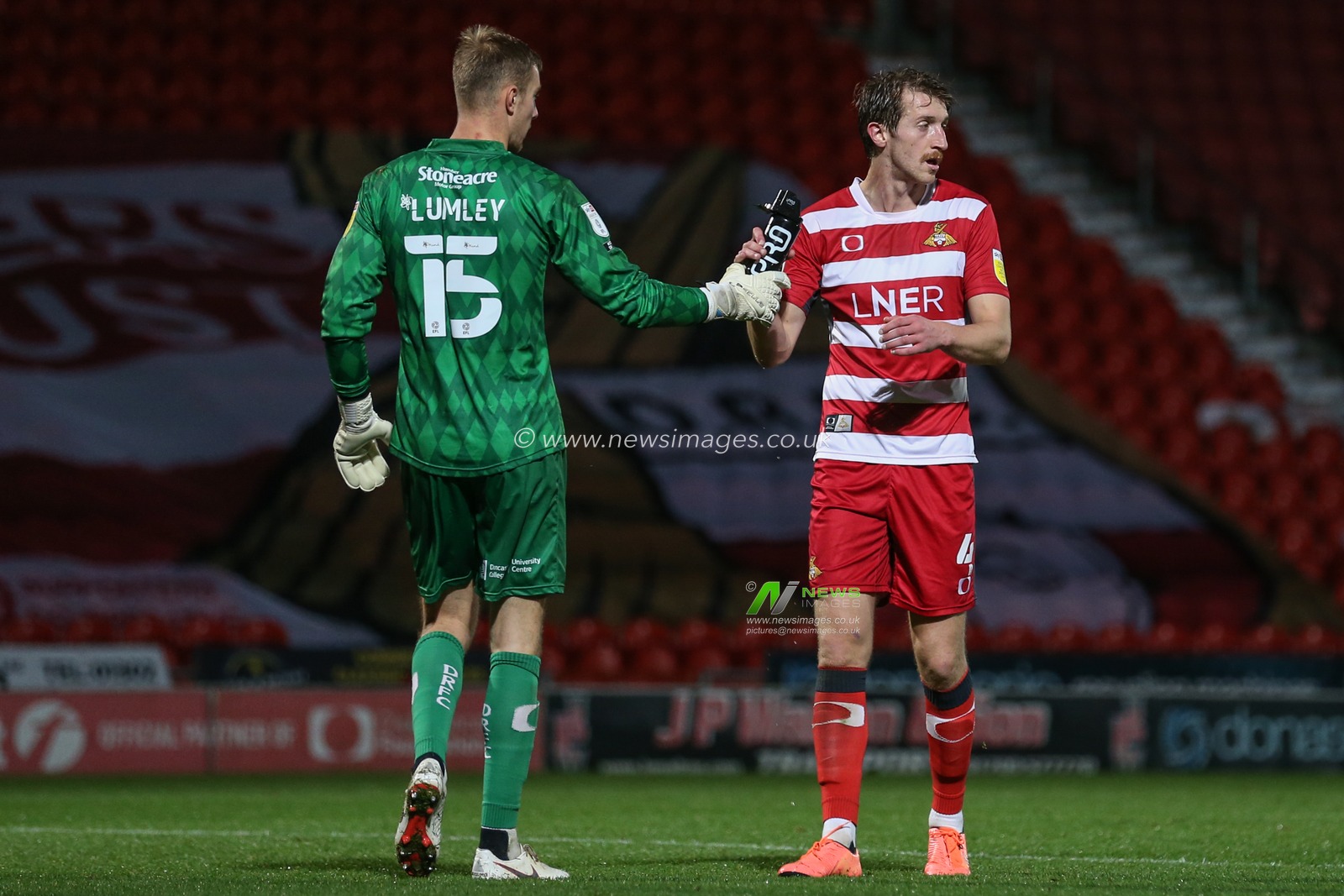 Tom Anderson #4 of Doncaster Rovers and emergency loan Joe Lumley #15 of Doncaster Rovers during the game