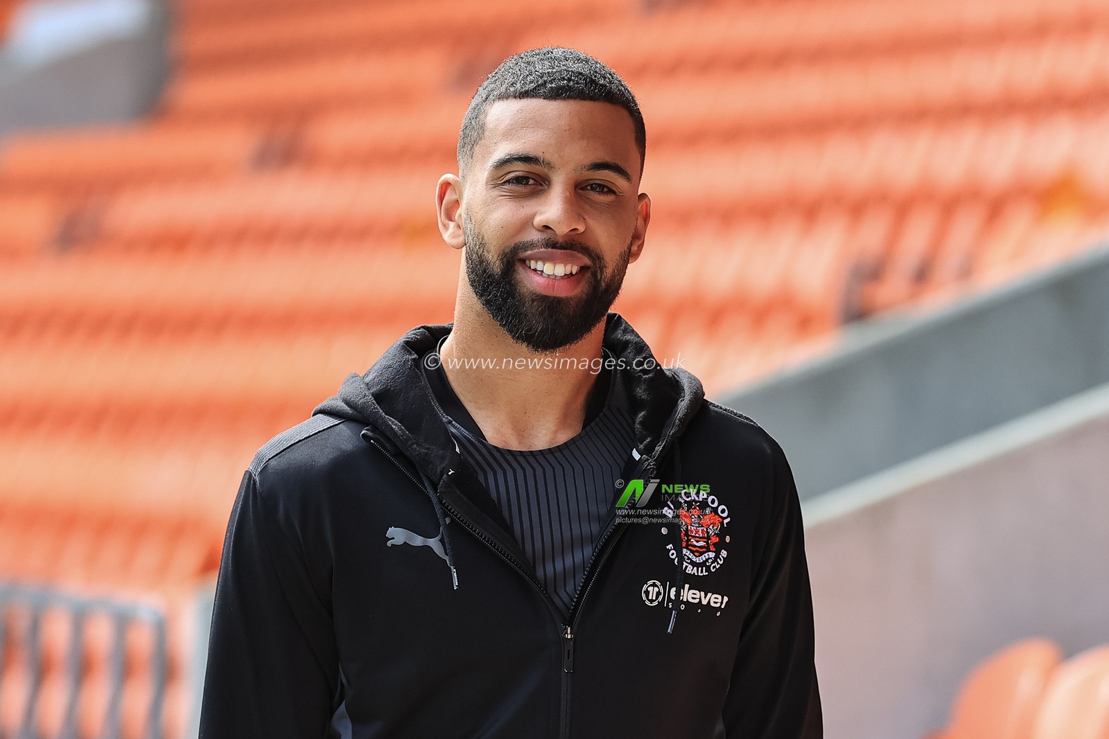 CJ Hamilton #22 of Blackpool arrives at Bloomfield Road