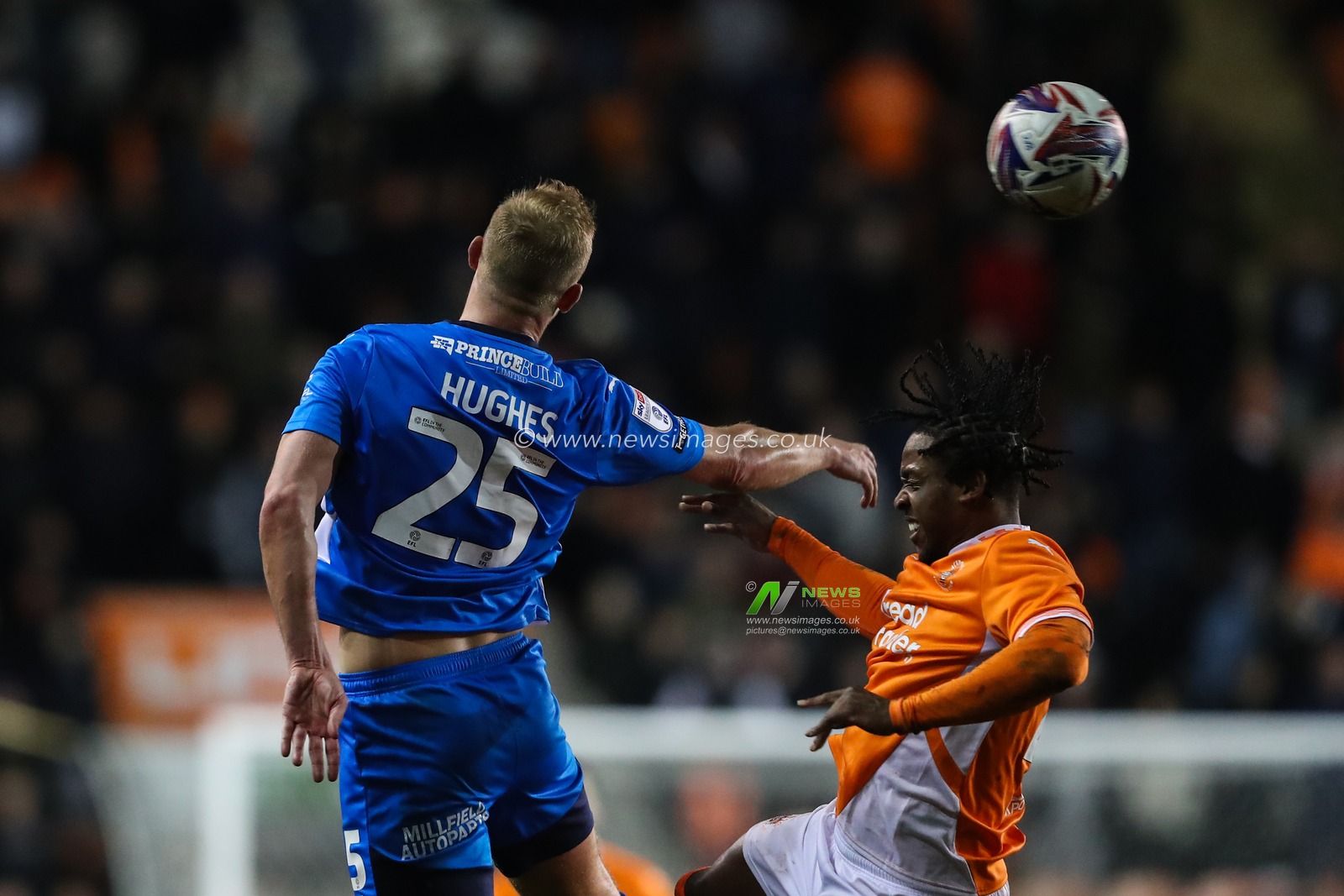 Sam Hughes of Peterborough United and Niall Ennis of Blackpool battle for the ball during the Sky Bet League 1 match Blackpool vs Peterborough United at Bloomfield Road, Blackpool, United Kingdom, 4th March 2025

(Photo by Gareth Evans/News Images)
