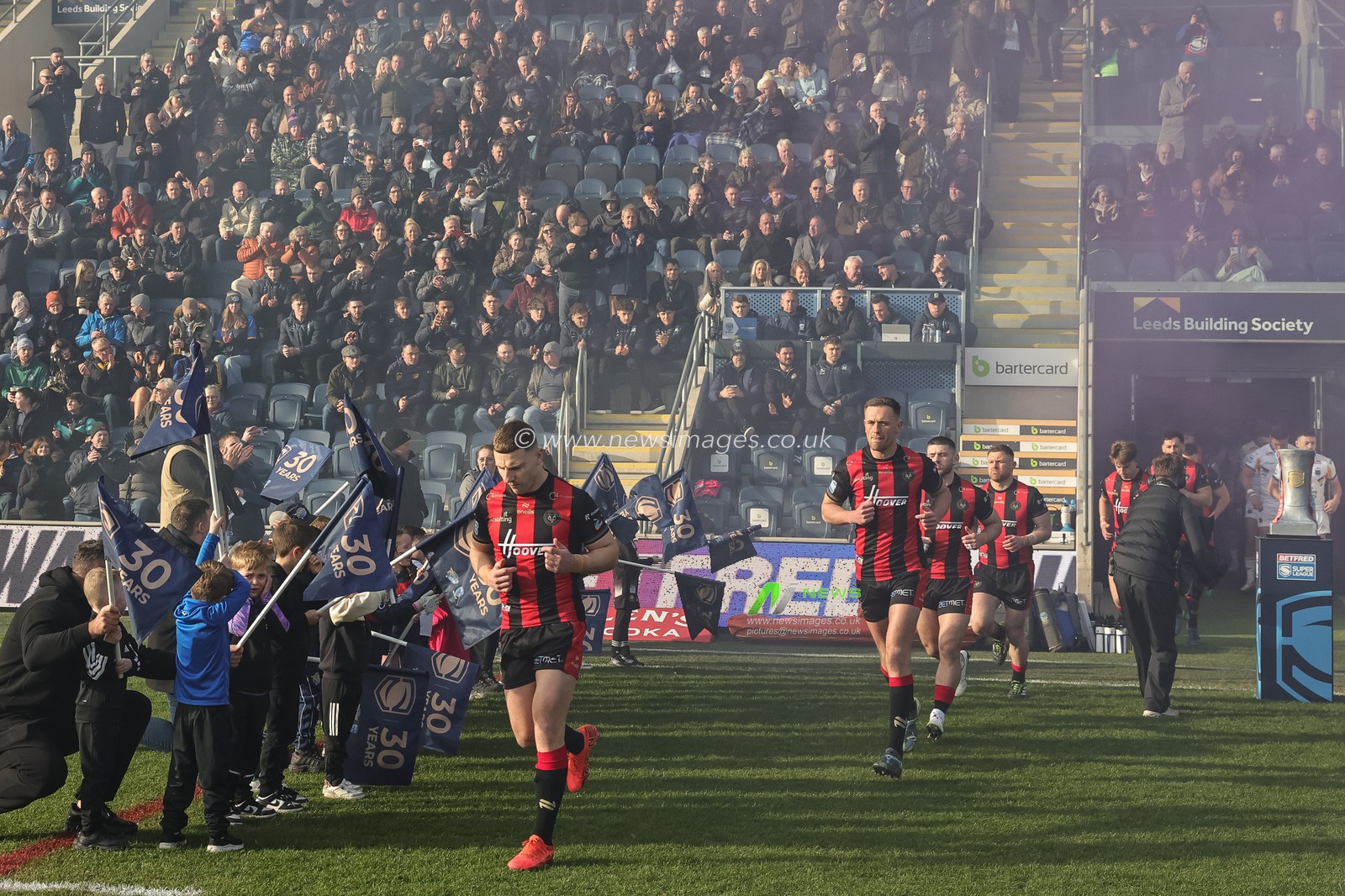 George Williams of Warrington Wolves leads out his team during the Betfred Super League round 6 match Leeds Rhinos vs Warrington Wolves at AMT Headingley Stadium, Leeds, United Kingdom on 29 March 2026

(Photo by Mark Cosgrove/News Images)