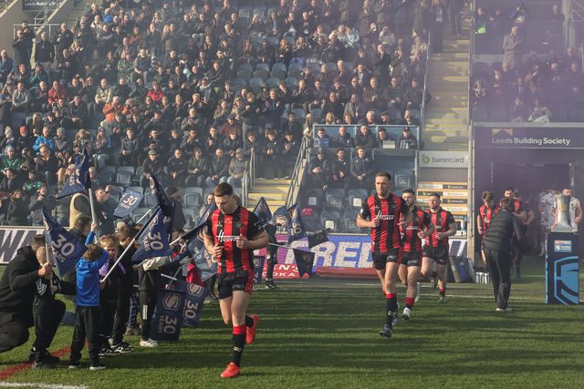 George Williams of Warrington Wolves leads out his team during the Betfred Super League round 6 match Leeds Rhinos vs Warrington Wolves at AMT Headingley Stadium, Leeds, United Kingdom on 29 March 2026

(Photo by Mark Cosgrove/News Images)