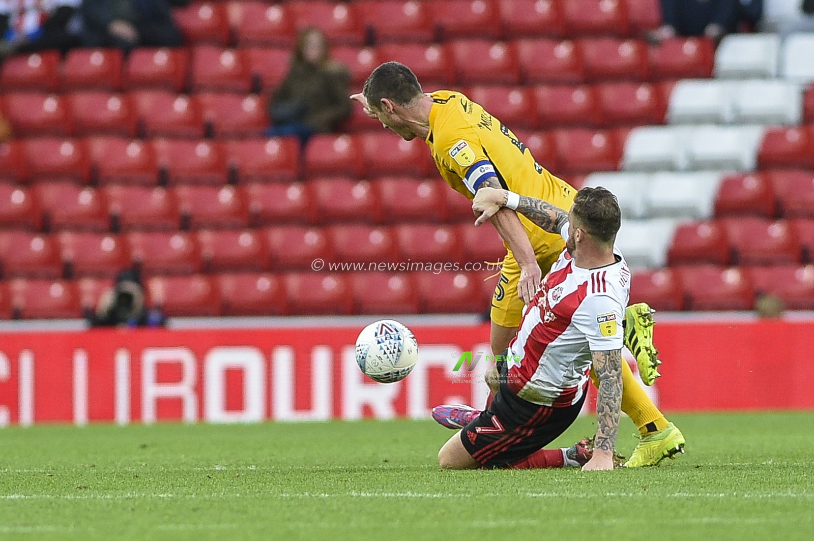 2nd November 2019, Stadium Of Light, Sunderland, England; Sky Bet League 1, Sunderland v Southend United : Chris Maguire of Sunderland tackles Southend United captain Mark Milligan

Credit: Iam Burn/News Images