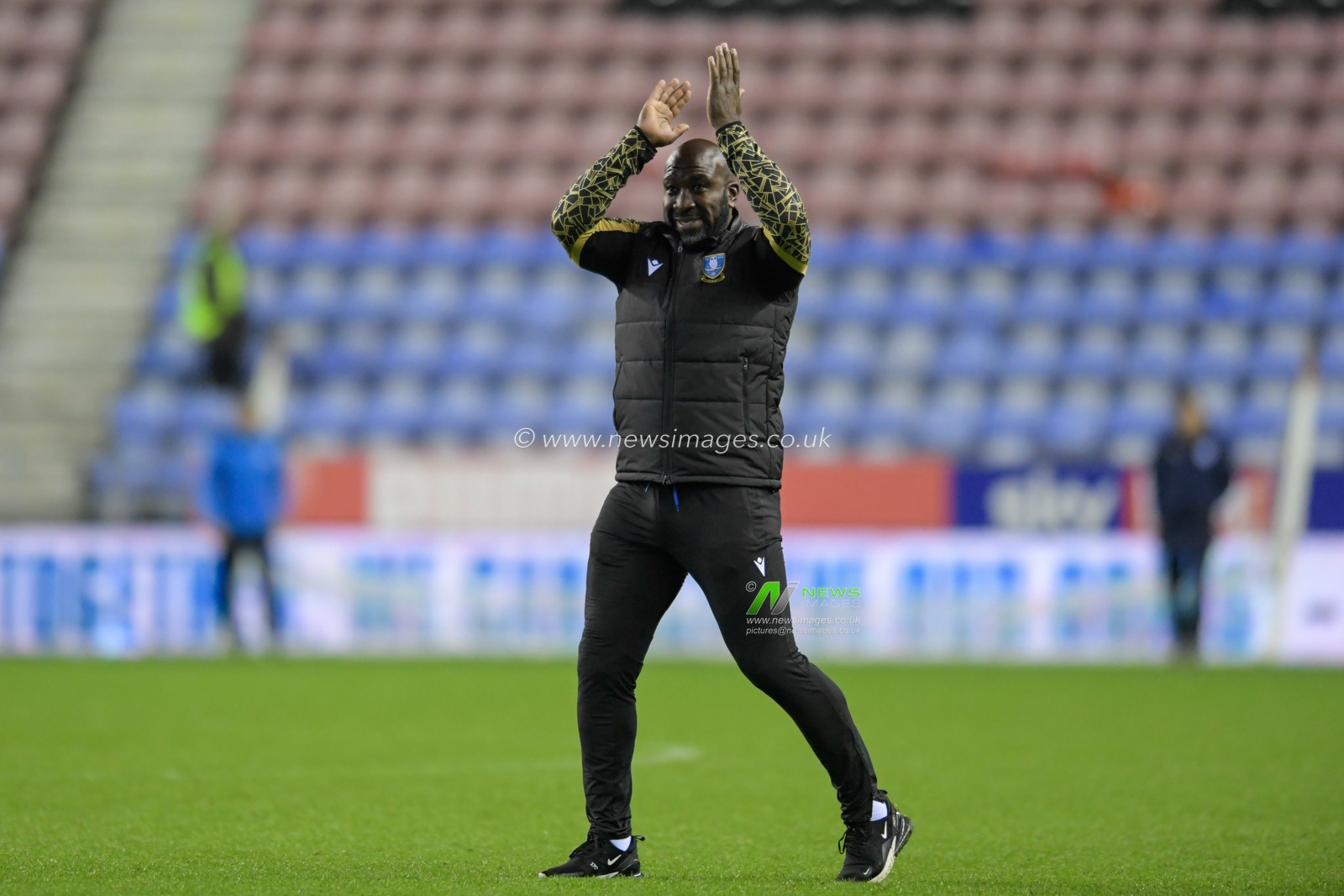 Darren Moore manager of Sheffield Wednesday celebrates in front of the travelling supporters after seeing his side beat Wigan Athletic 1-2