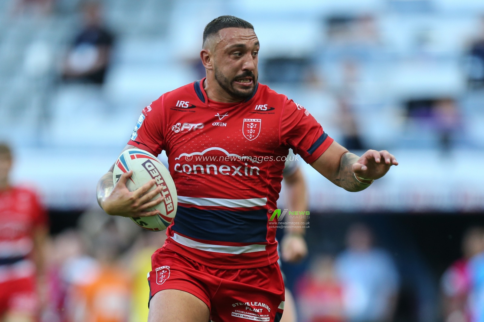 Elliot Minchella #17 of Hull KR runs with the ball up the pitch