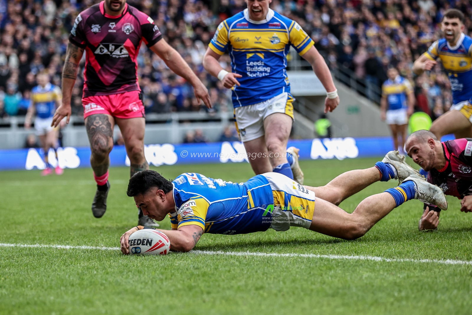 Keenan Palasia of Leeds Rhinos goes over for a try during the Betfred Super League Round 3 match Leeds Rhinos vs Castleford Tigers at Headingley Stadium, Leeds, United Kingdom, 2nd March 2025

(Photo by Alfie Cosgrove/News Images)
