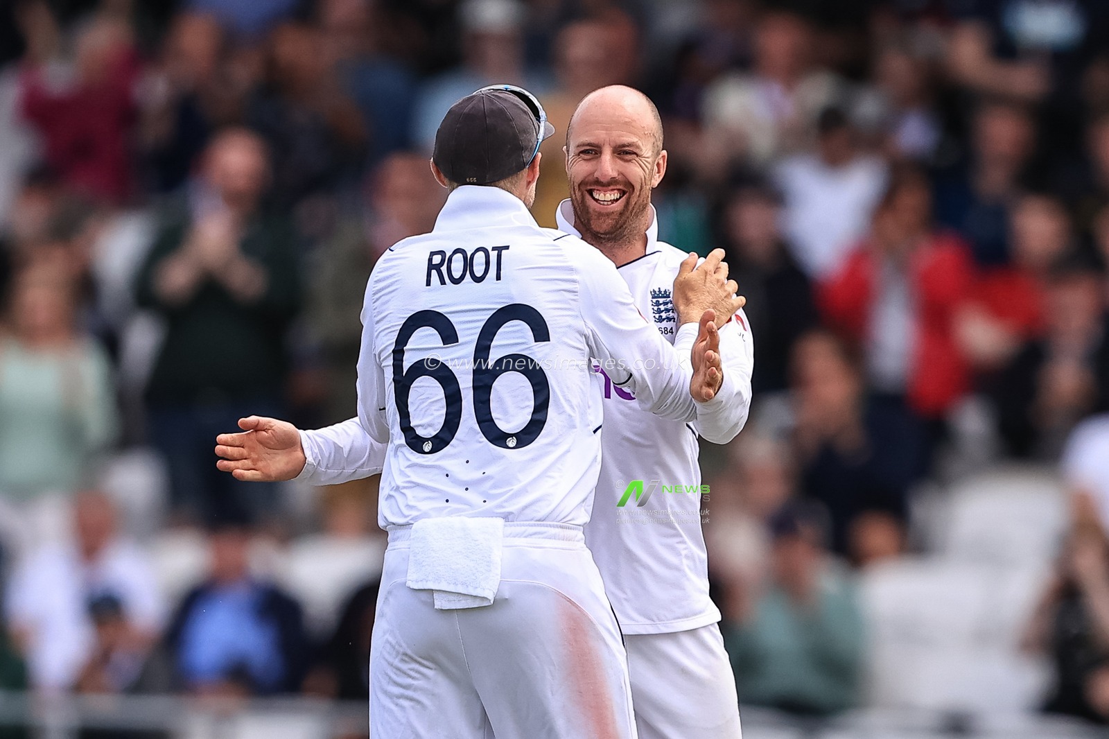 Jack Leach of England celebrates the wicket of Michael Bracewell of New Zealand with Joe Root of England