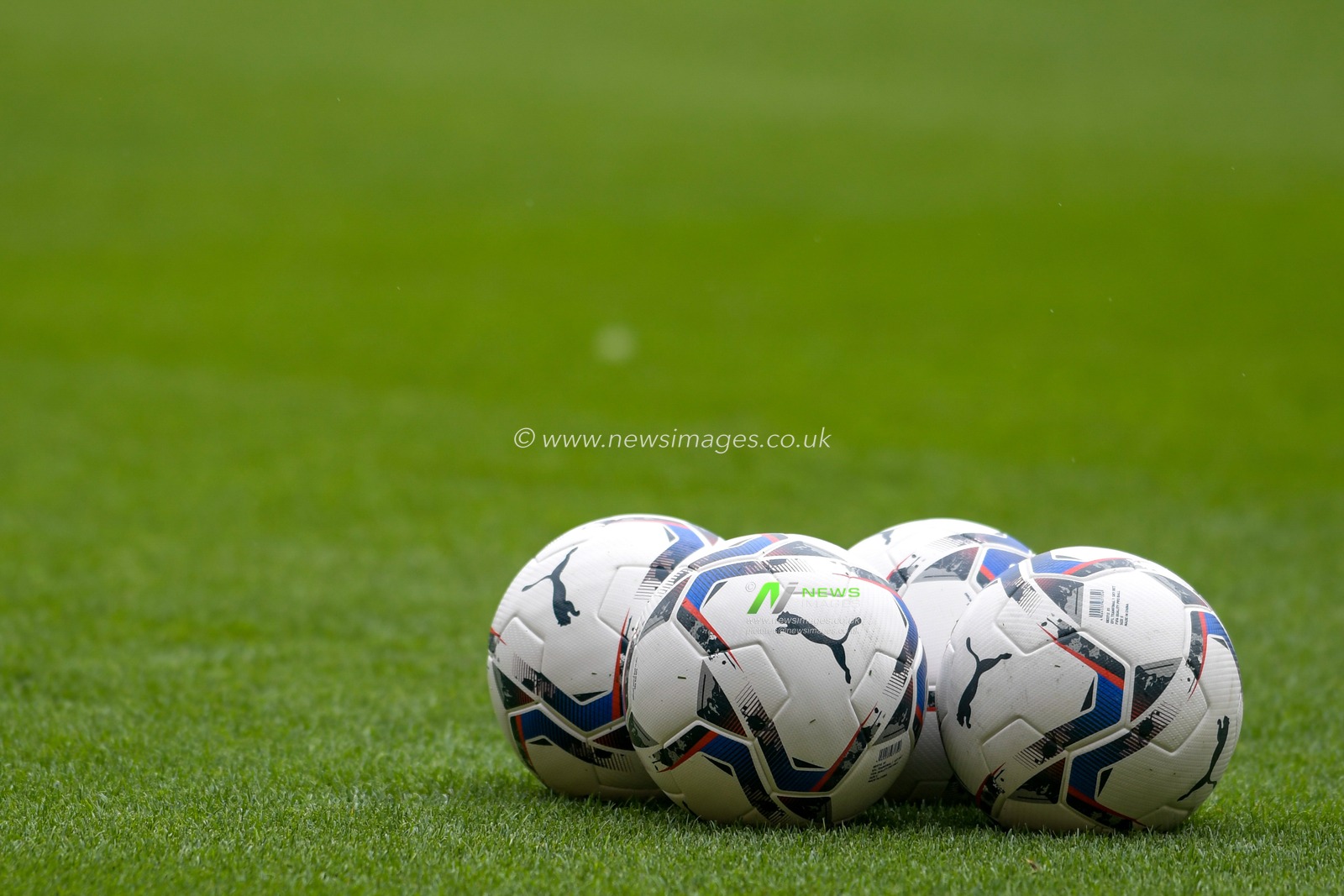 The Puma match balls on the pitch