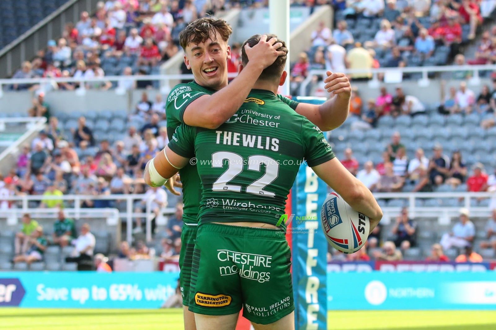 Josh Thewlis #22 of Warrington Wolves celebrates his try