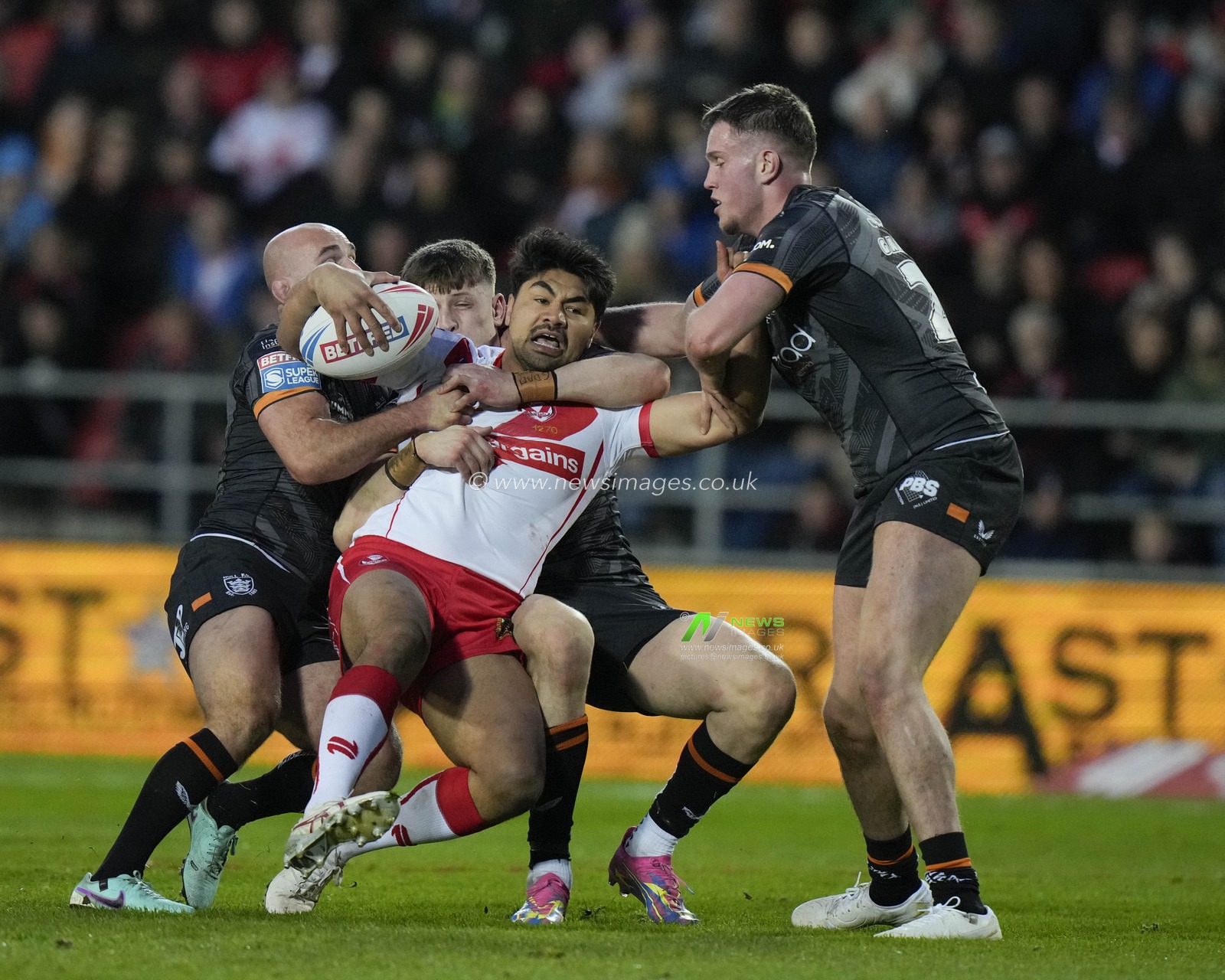 James Bell of St. Helens drives into the Hull FC  defence during the Betfred Super League  Round 8 match St Helens vs Hull FC at Totally Wicked Stadium, St Helens, United Kingdom, 19th April 2024

(Photo by Steve Flynn/News Images)