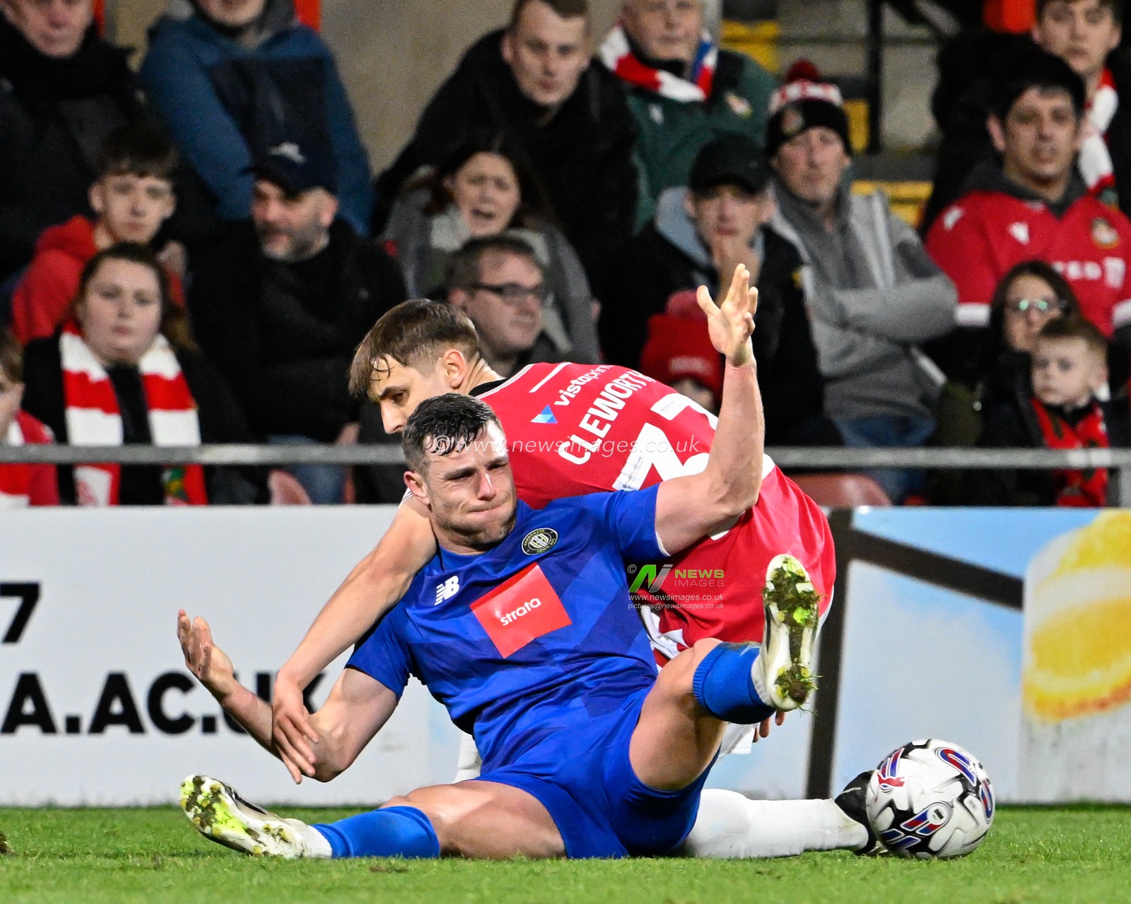 Max Cleworth of Wrexham fouls Jack Muldoon of Harrogate Town, during the Sky Bet League 2 match Wrexham vs Harrogate Town at SToK Cae Ras, Wrexham, United Kingdom, 12th March 2024

(Photo by Cody Froggatt/News Images)