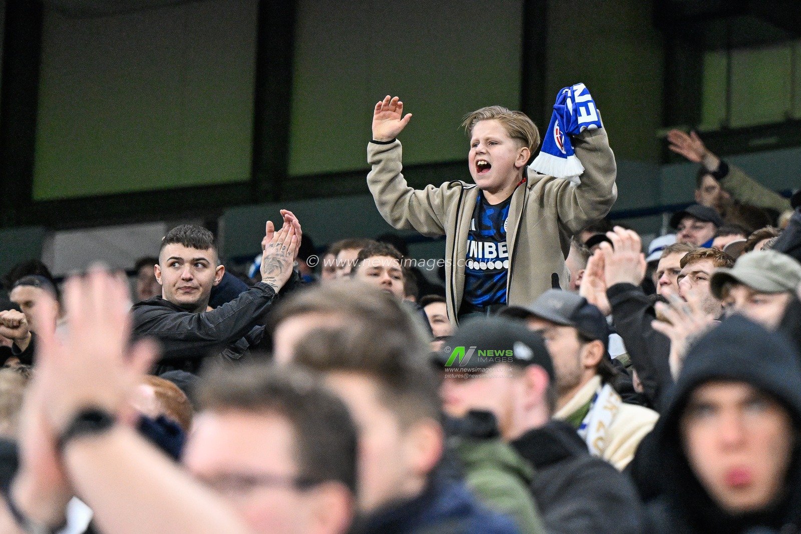 A young F.C. Copenhagen cheers on his team during the UEFA Champions League match Manchester City vs F.C. Copenhagen at Etihad Stadium, Manchester, United Kingdom, 6th March 2024

(Photo by Cody Froggatt/News Images)