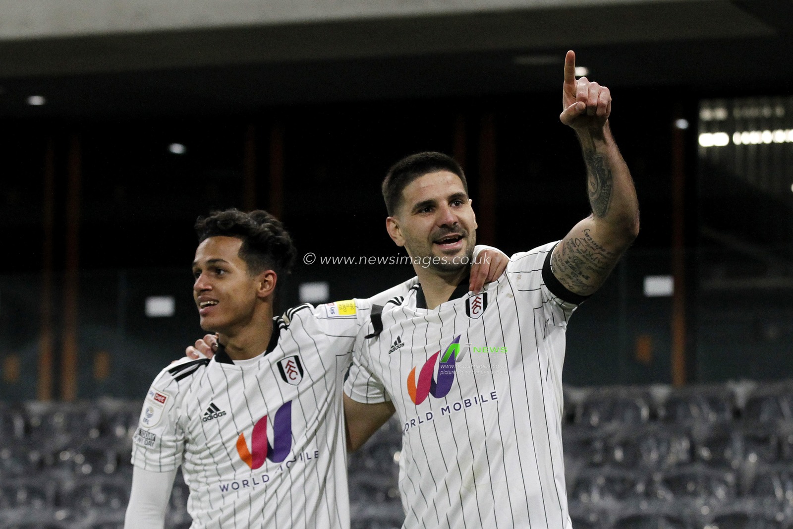 GOAL: Aleksandar Mitrovic #9 of Fulham celebrates scoring with Fabio Carvalho #28 of Fulham.