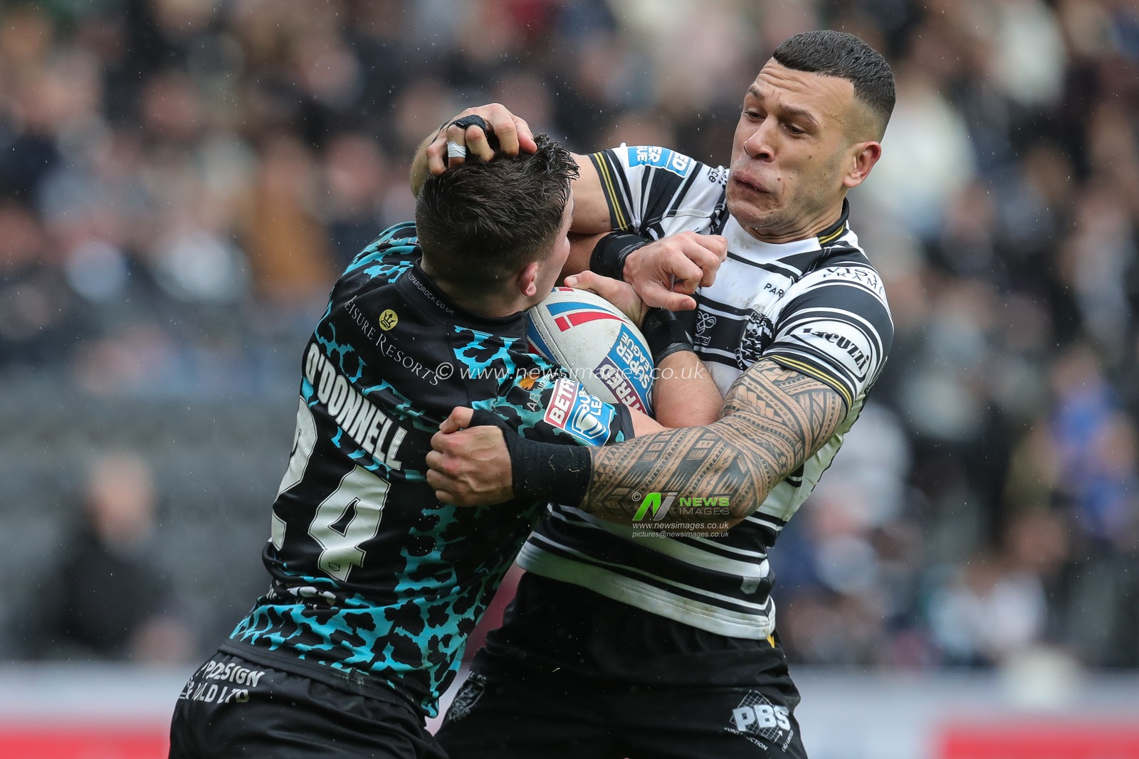 Carlos Tuimavave #3 of Hull FC tackles Kai Oâ€™Donnell #24 of Leigh Leopards during the Betfred Super League  Round 6 match Hull FC vs Leigh Leopards at MKM Stadium, Hull, United Kingdom, 25th March 2023

(Photo by James Heaton/News Images)