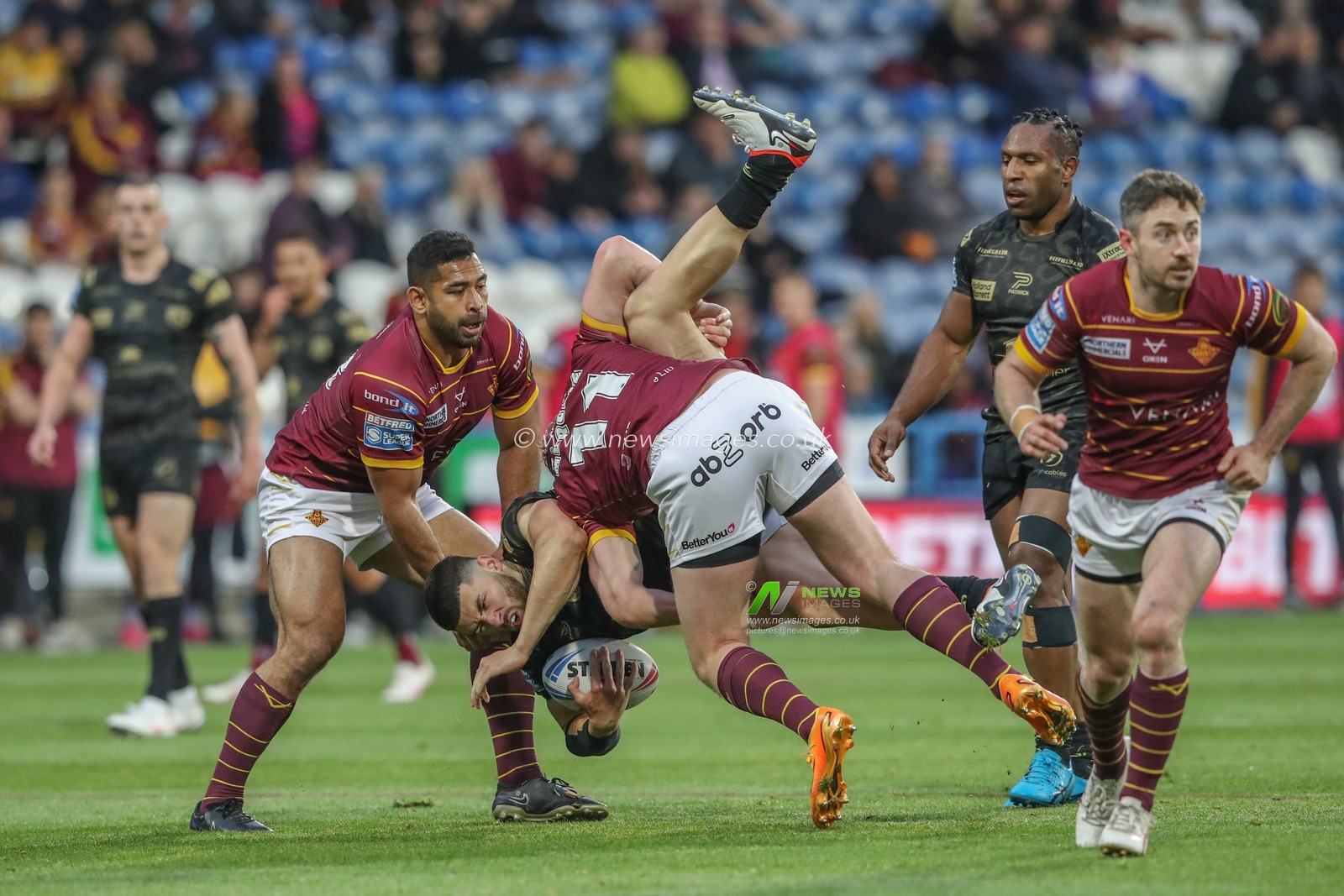Dan Norman of Leigh Leopards is tackled by Jack Murchie of Huddersfield Giants during the Betfred Super League Round 12 match Huddersfield Giants vs Leigh Leopards at John Smith's Stadium, Huddersfield, United Kingdom, 24th May 2024

(Photo by Alfie Cosgrove/News Images)