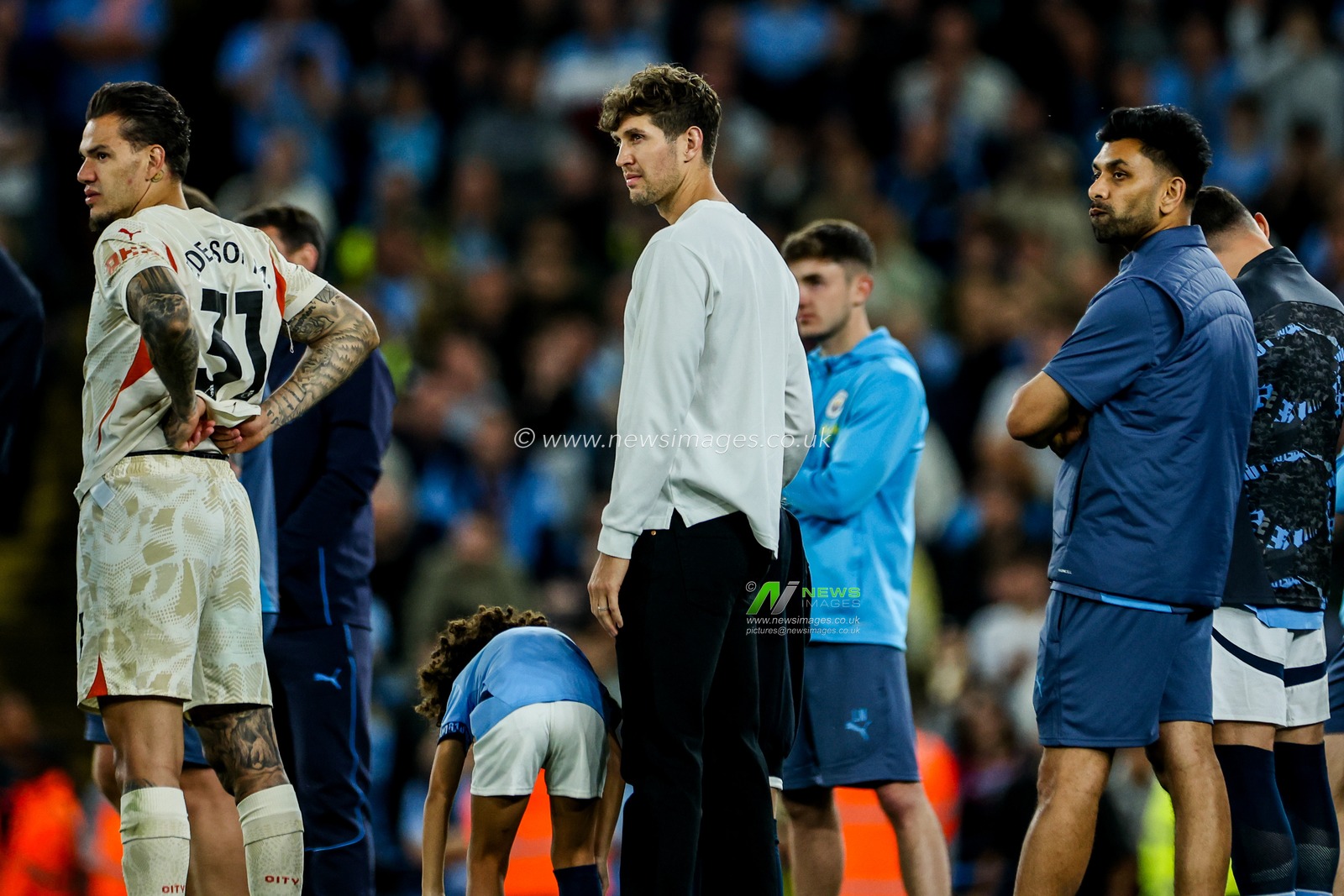 John Stones of Manchester City watches on as the club thank Kevin De Bruyne following the Premier League match Manchester City vs Bournemouth at Etihad Stadium, Manchester, United Kingdom, 20th May 2025

(Photo by Mark Cosgrove/News Images)