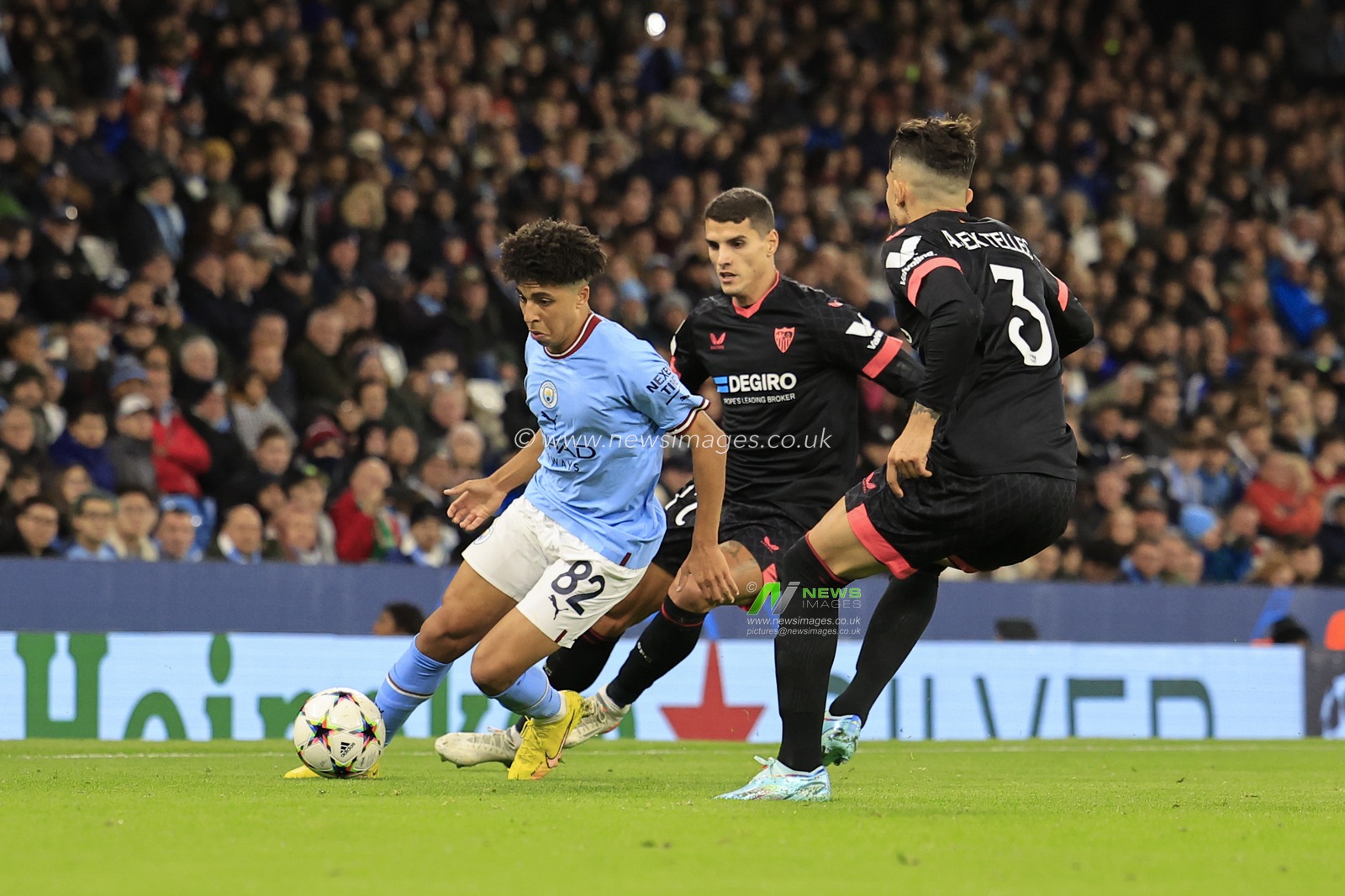 Rico Lewis #82 of Manchester City tries to get past Alex Telles #3 of Sevilla during the UEFA Champions League match Manchester City vs Sevilla at Etihad Stadium, Manchester, United Kingdom, 2nd November 2022

(Photo by Conor Molloy/News Images)