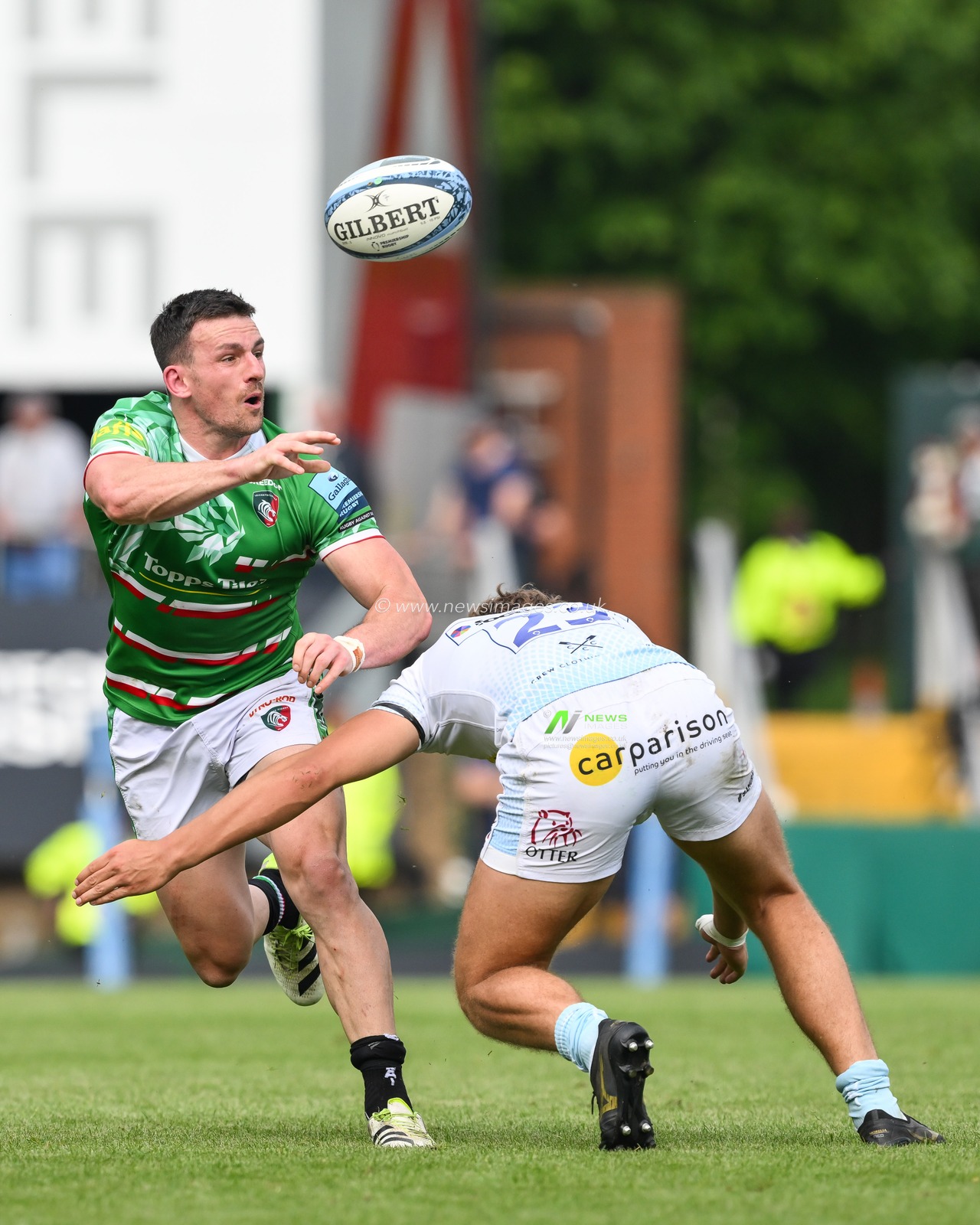 Matt Scott of Leicester Tigers off loads the ball despite the tackle of Zack Wimbush of Exeter Chiefs during the Gallagher Premiership match Leicester Tigers vs Exeter Chiefs at Mattioli Woods Welford Road, Leicester, United Kingdom, 18th May 2024

(Photo by Craig Thomas/News Images)