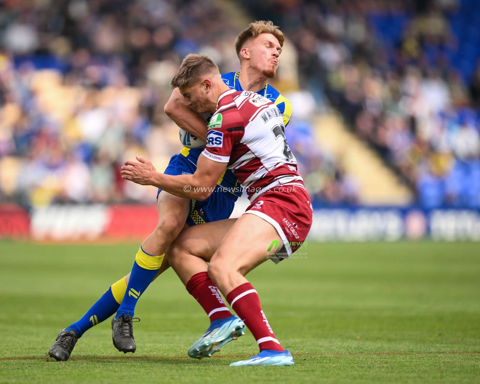 Nolan Tupaea of Warrington Wolves is tackled by Sam Walters of Wigan Warriors during the Betfred Super League Round 13 match Warrington Wolves vs Wigan Warriors at Halliwell Jones Stadium, Warrington, United Kingdom, 1st June 2024

(Photo by Craig Thomas/News Images)